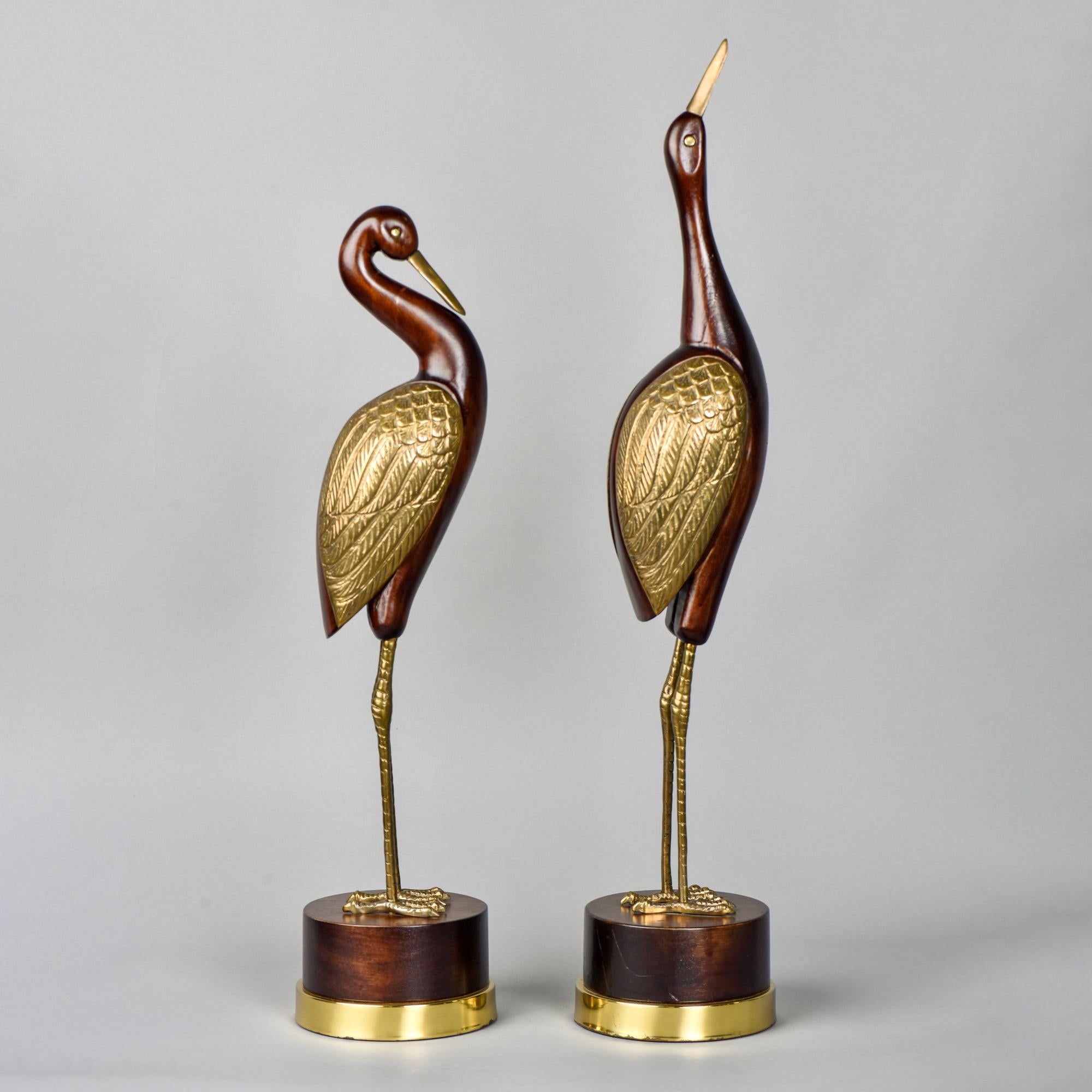 Pair of tall, slender birds of wood and brass by Frederick Cooper of Chicago, circa 1960s. Measurement shown is for taller bird. Shorter bird is 24.75” tall. Sold and priced as a pair.