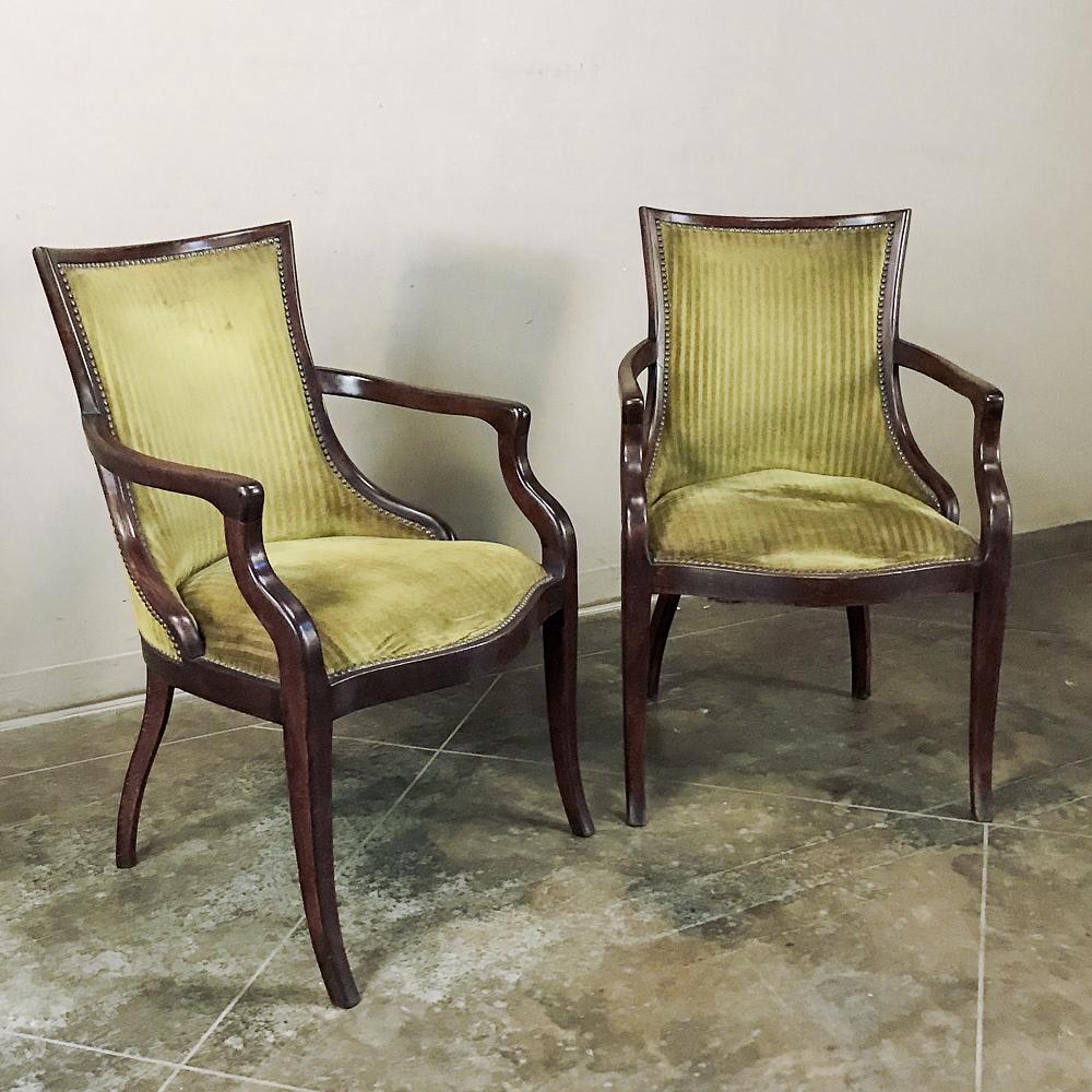 Pair of midcentury French armchairs feature graceful, tailored lines and were handcrafted from exotic imported mahogany!
circa mid-1900s
Each measures: 35H x 24W x 20D - Seat 18H.
