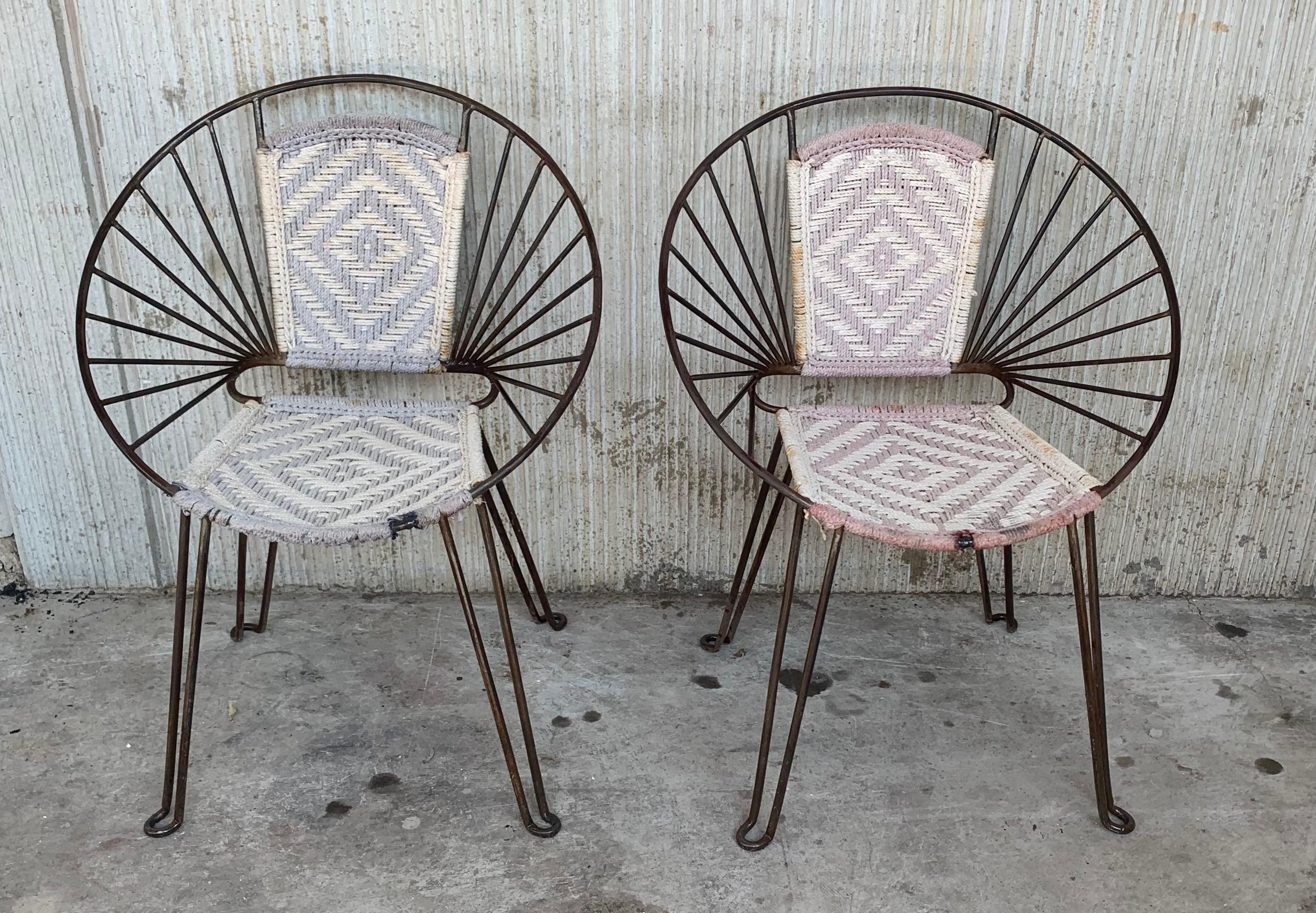 Great Mid-Century Modern iron chairs in a striking bare metal style finish. Wonderful round frame, caned seat, strong iron legs. Vintage modern Salterini style design.