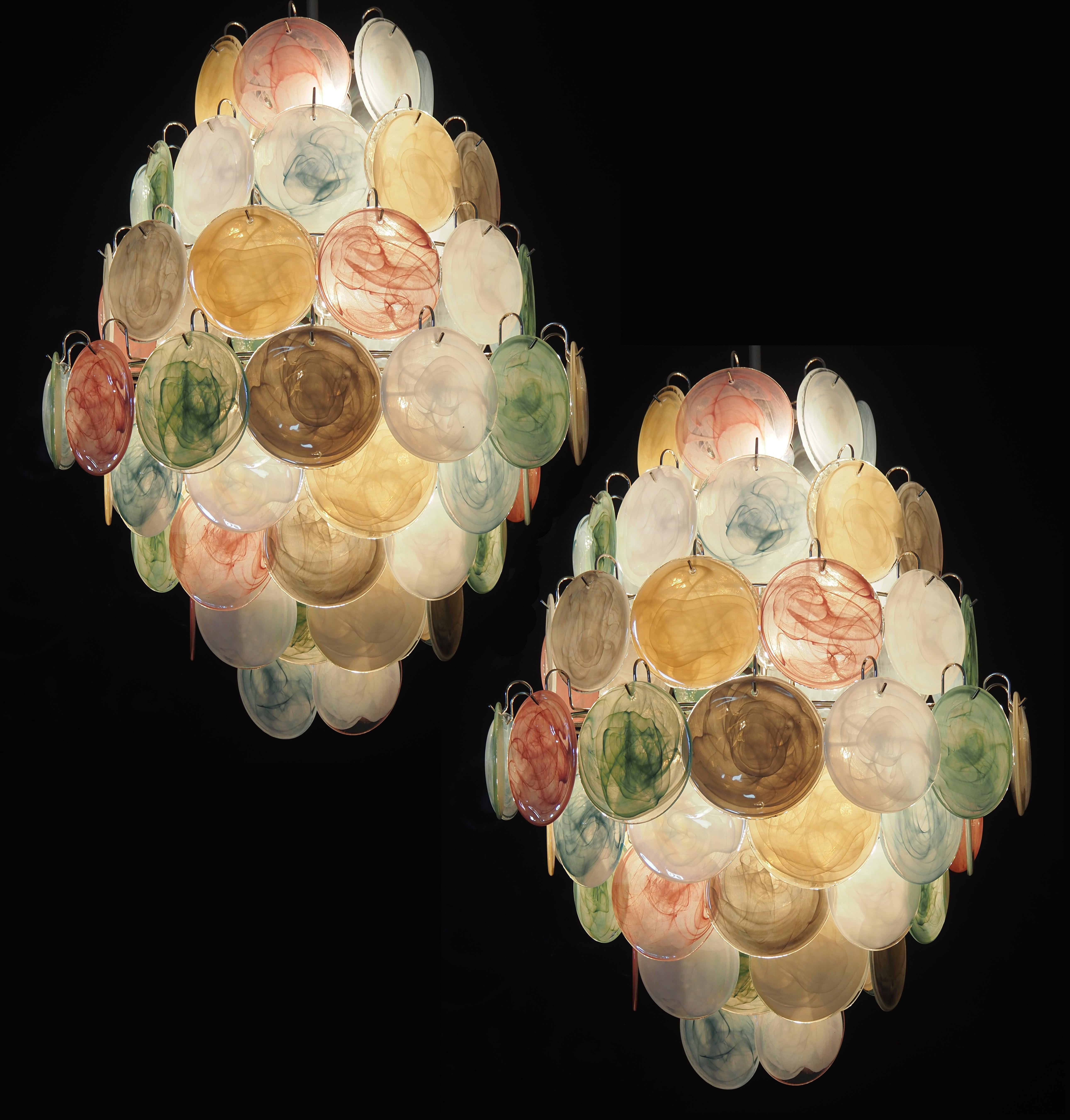 Vintage Italian Murano chandeliers in Vistosi style. The chandelier has 87 fantastic multicolored alabaster iridescent glasses in a nickel metal frame.
Period: late XX century
Dimensions: 67,80 inches (175 cm) height with chain; 40,70 inches (105