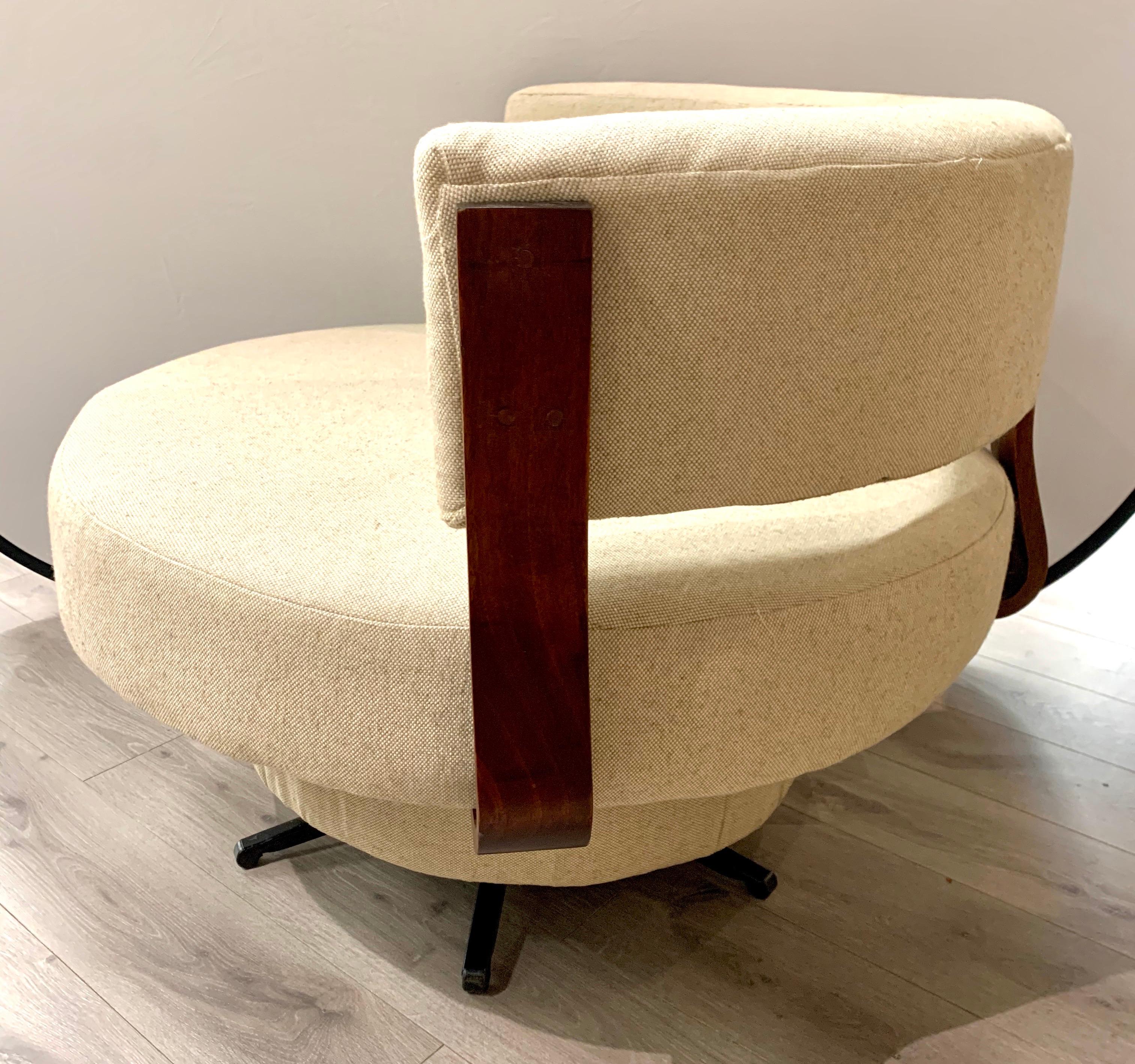 Pair of matching, elegant and large, Mid-Century Modern round swivel chairs with new Herman Miller oatmeal fabric.
Please note we have a single but are selling as a pair in this particular auction. Important to note
that the chairs are on the