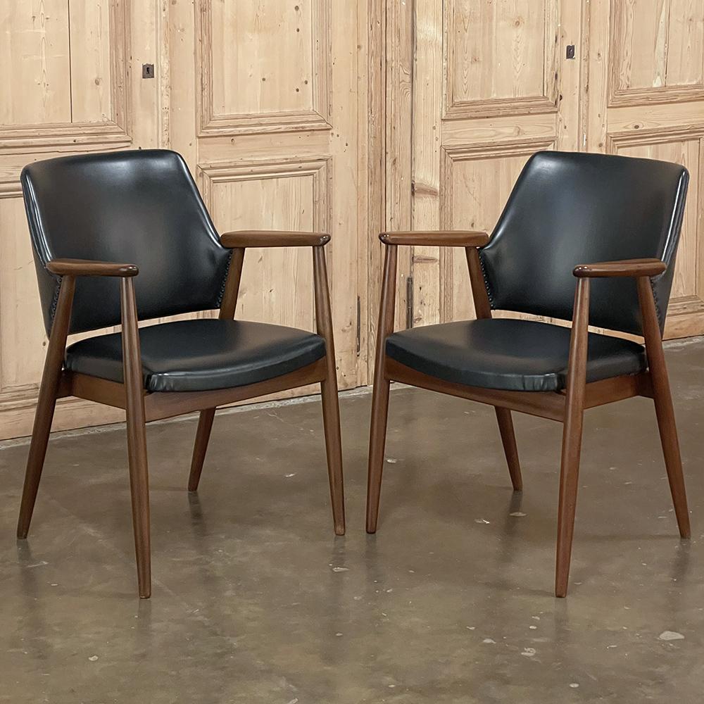 Pair Mid-Century Mahogany & Faux Leather armchairs are just the ticket for creating a sleek, post-modern look to any room or office! The tailored lines of the framework were crafted from fine mahogany, and feature a subtly contoured and nicely