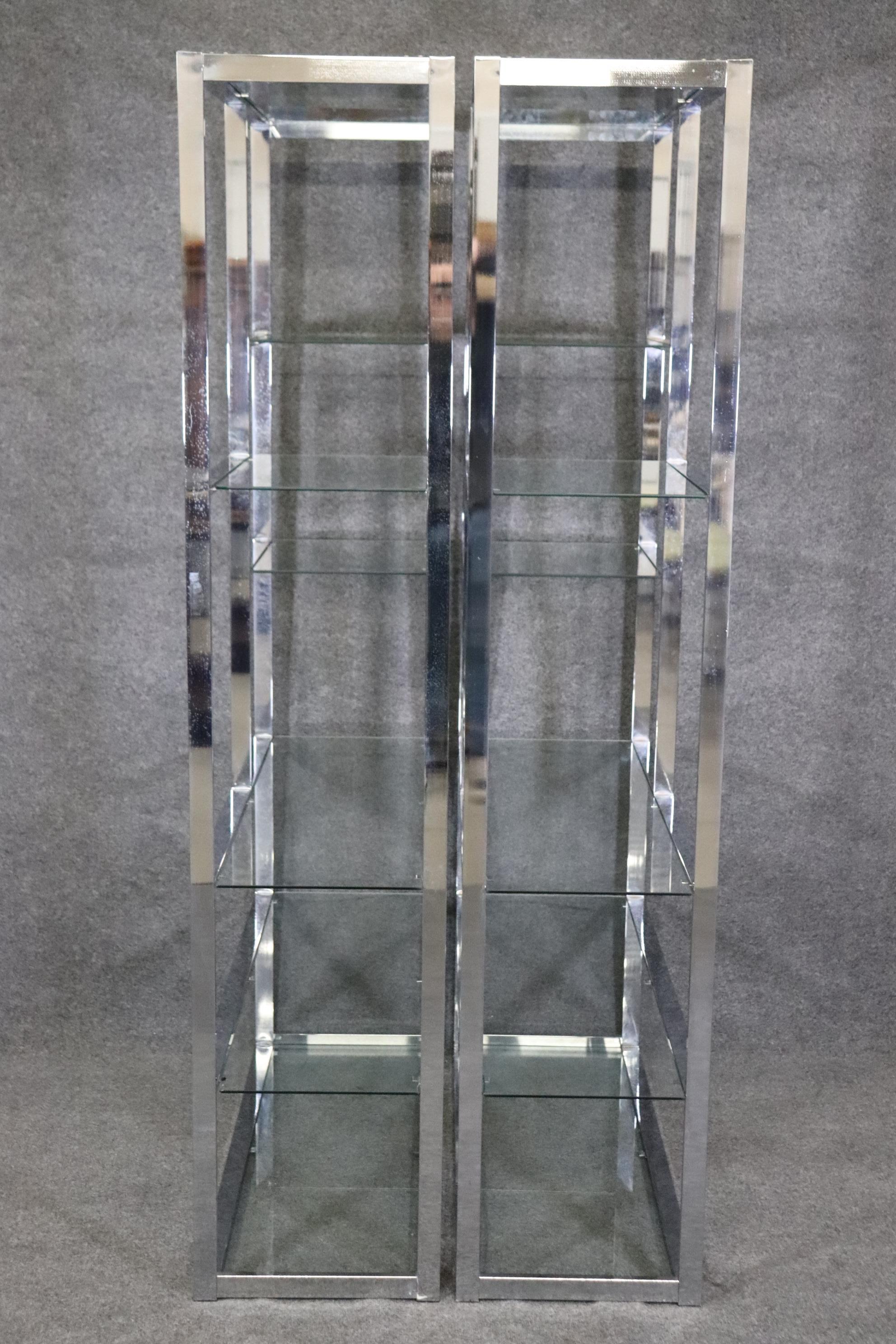 Dimensions- H: 78in W: 42in D: 16 1/4in 
This Pair of midcentury Milo Baughman Style Chrome and Glass Etageres are made of the highest quality and are truly a prime example of Mid Century Modern luxury decor/furniture. If you look at the photos