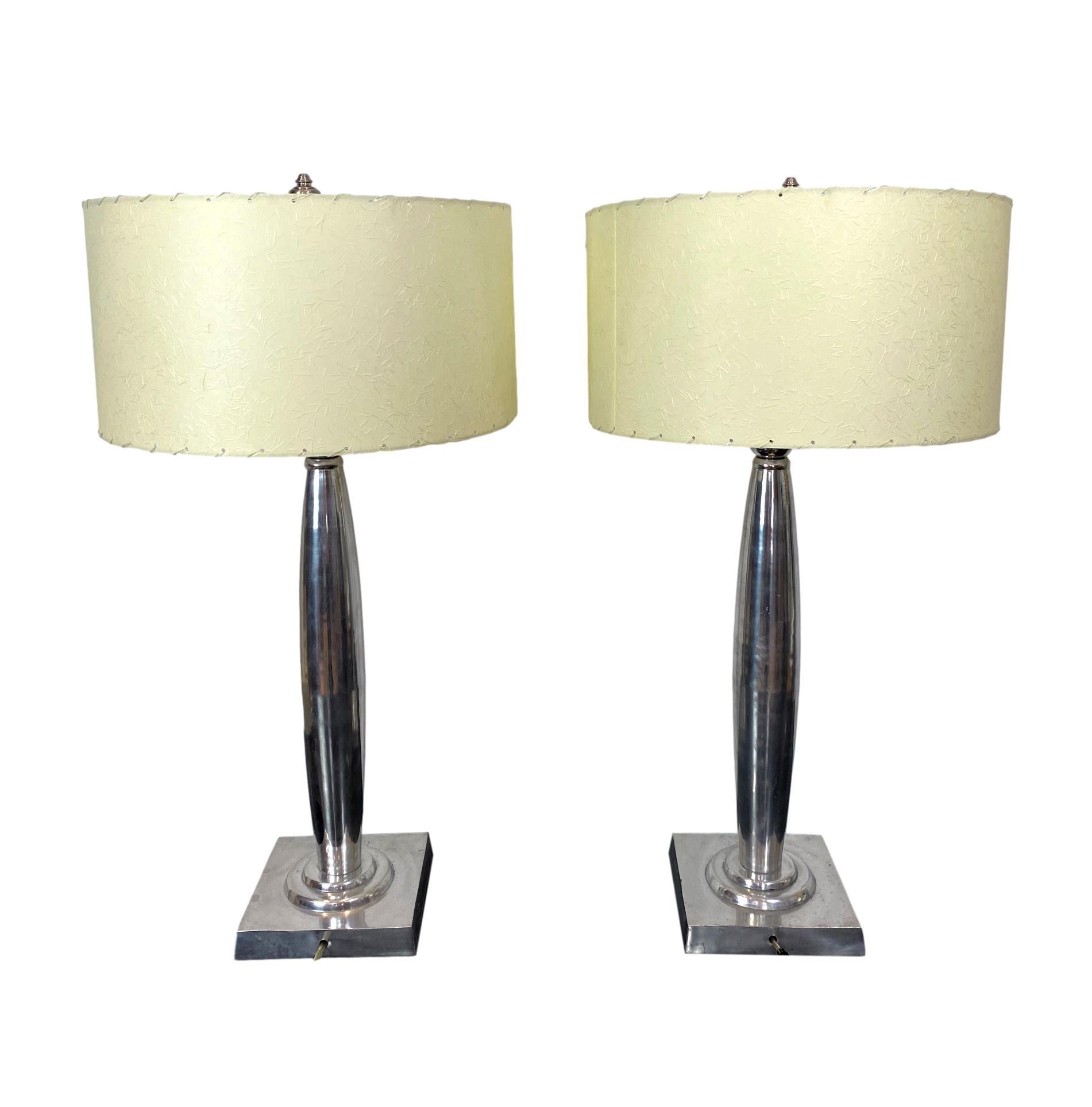 Pair Mid-Century Modern aluminum table lamps, French, ca. 1960's, with new hand-sewn custom-made, laced shades, 33 inches high.