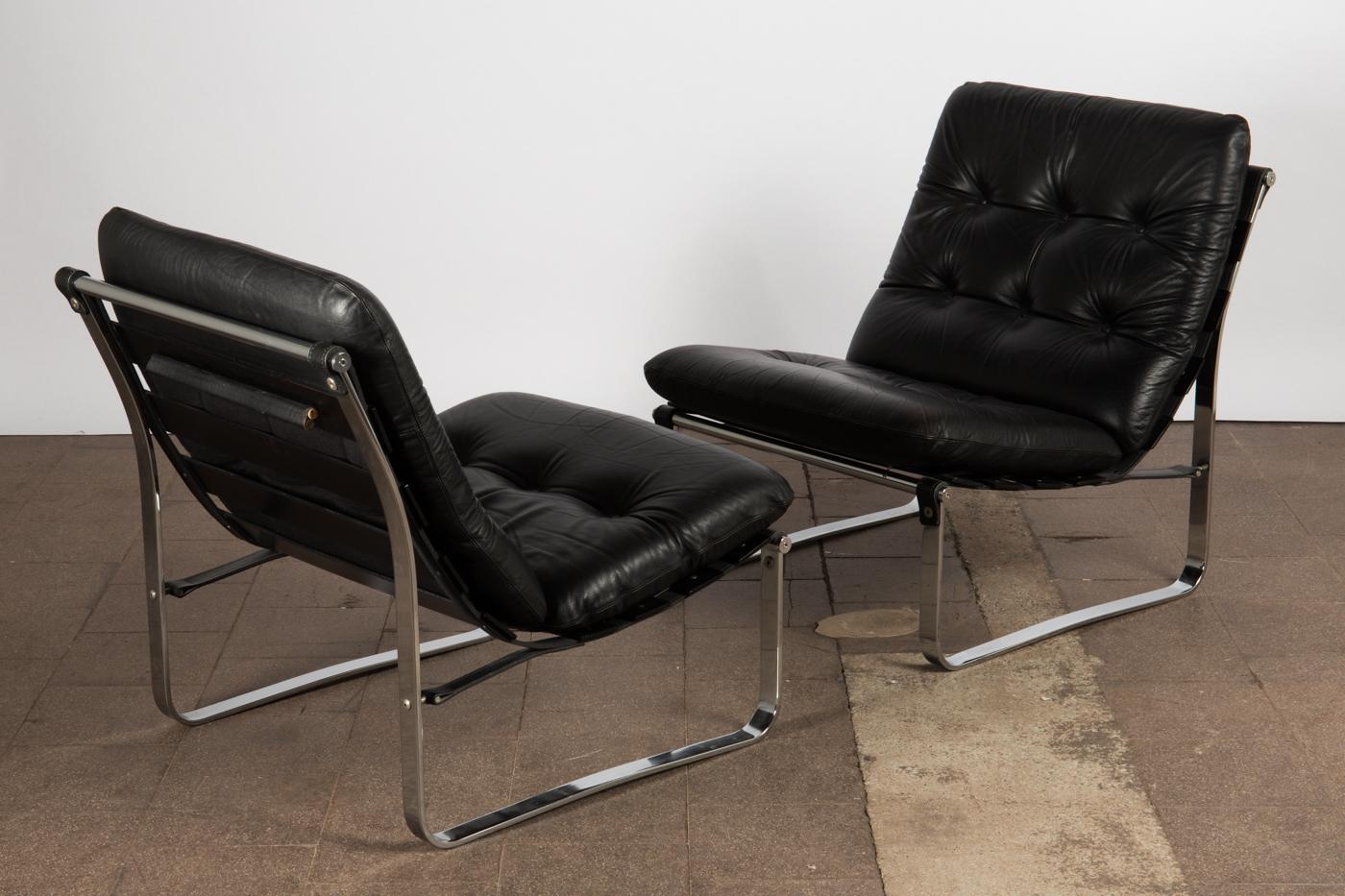 A pair of vintage Danish, midcentury black leather spring chairs by Ingmar Relling, for Westnofa Furniture.