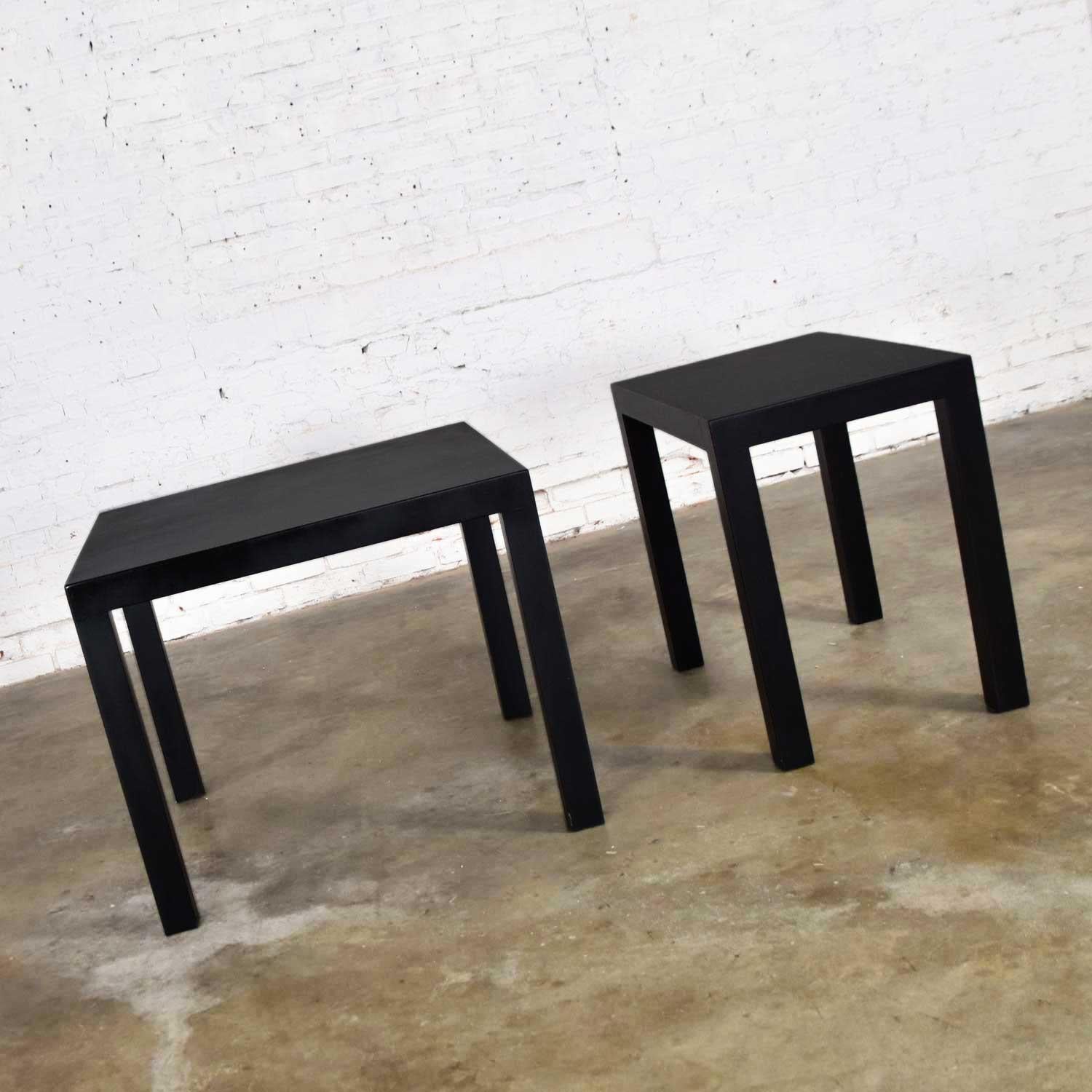 Fabulous pair of Mid-Century Modern black lacquered Parsons style side tables. One (1) square and one (1) rectangle. In beautiful vintage condition. These have been completely refinished and repainted and a urethane coat has been added for