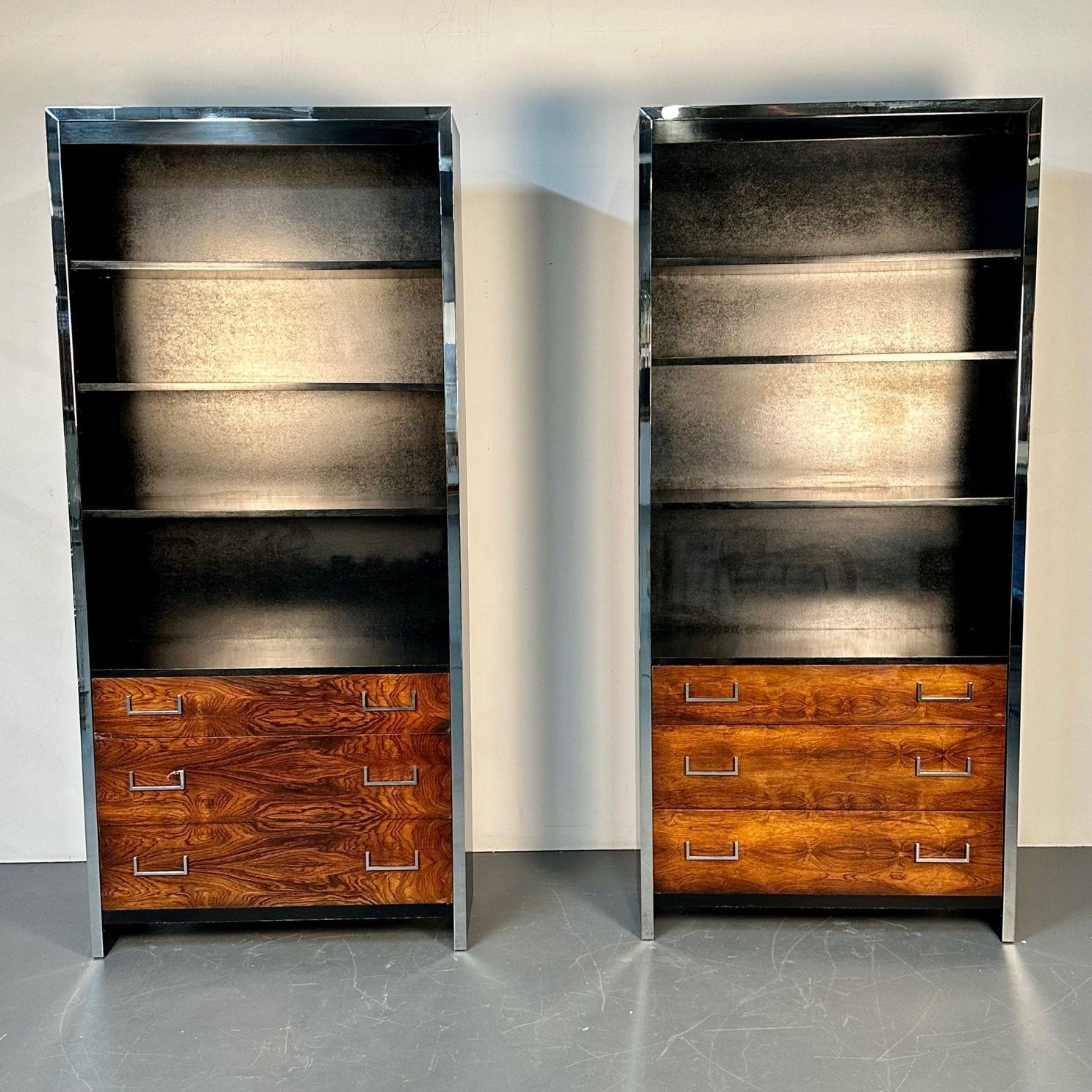 Pair Mid-Century Modern Bookcases / Shelving Unit, Milo Baughman for John Stuart
 
Set of mid-century shelving units designed by Milo Baughman for John Stuart circa 1950s. Each bookcase having three rosewood front drawers, ebonized top, sides, and