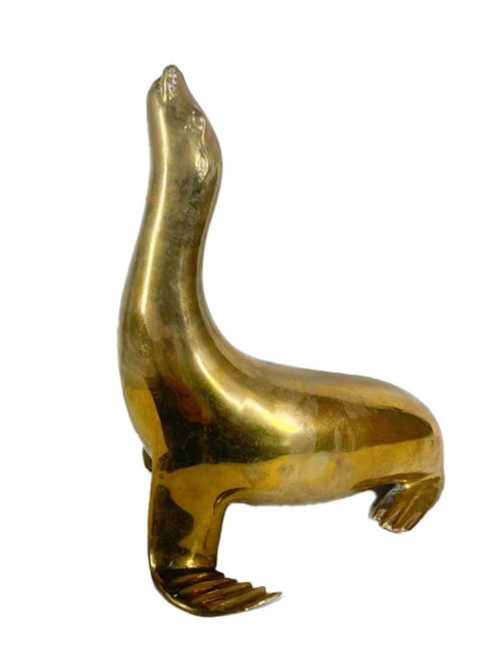 20th Century Pair Mid-Century Modern Cast Brass Figures of Seals with Noses Pointed Up For Sale