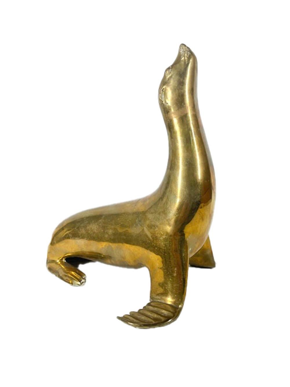 Pair Mid-Century Modern Cast Brass Figures of Seals with Noses Pointed Up For Sale 1