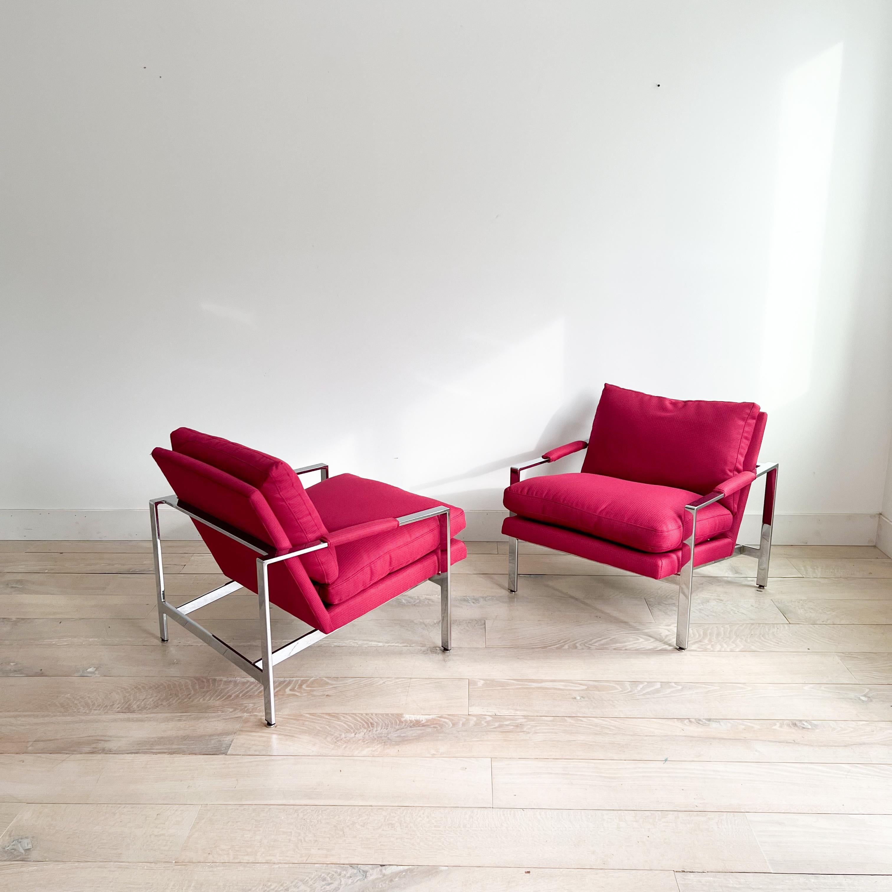 Elevate your living space with this stylish pair of mid-century modern lounge chairs by renowned designer Milo Baughman for Thayer Coggin. Crafted with sleek chrome frames and featuring vibrant bright pink upholstery, these chairs are sure to make a