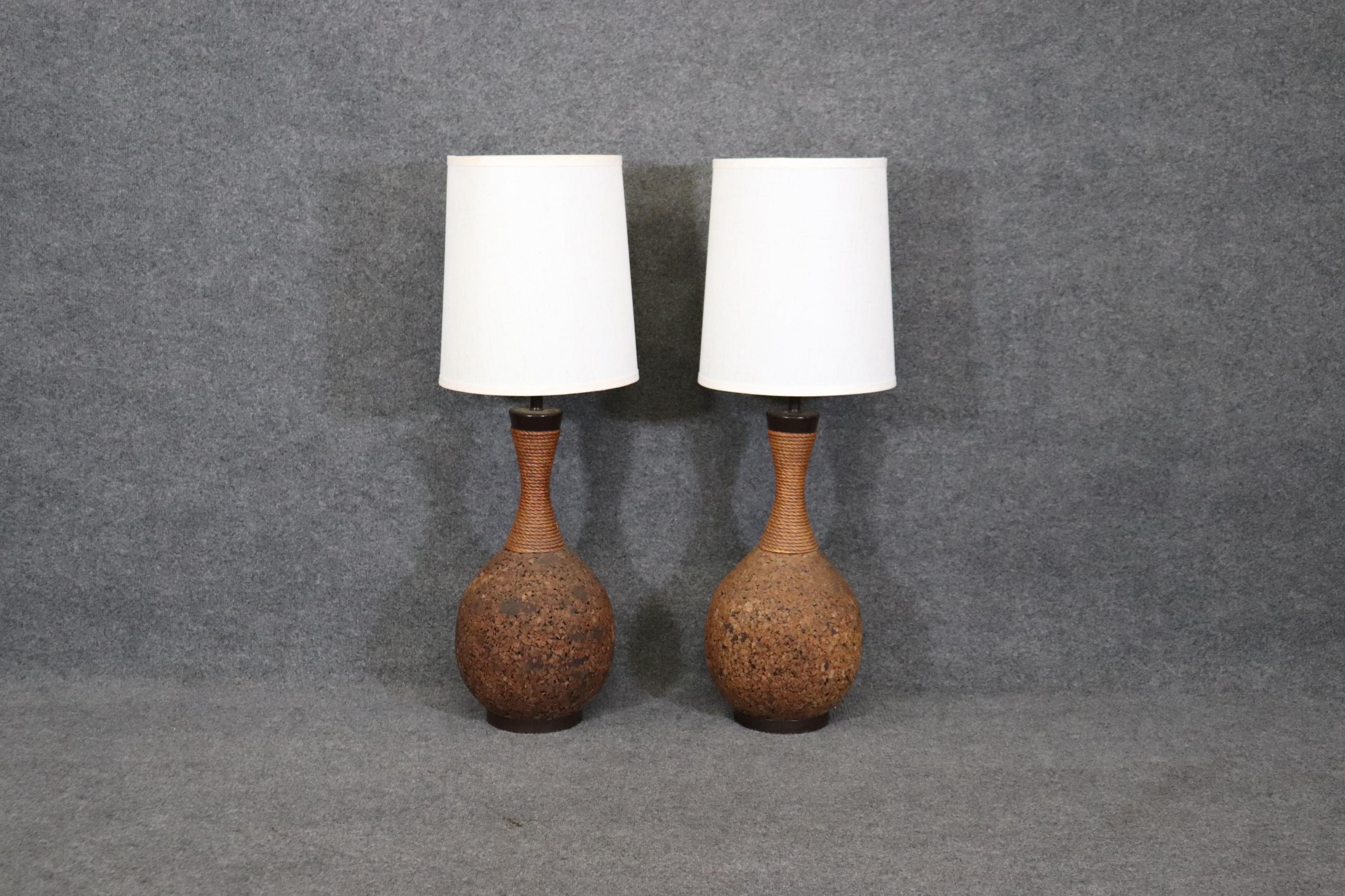 Dimensions- H: 41 1/4in W: 14 1/4in D: 14 1/4in (measurements with shades on) 
                       H: 37 3/4in W: 11 1/2in D: 11 1/2in (measurements without shades)

This pair of Mid Century Modern cork table lamps is truly an example of