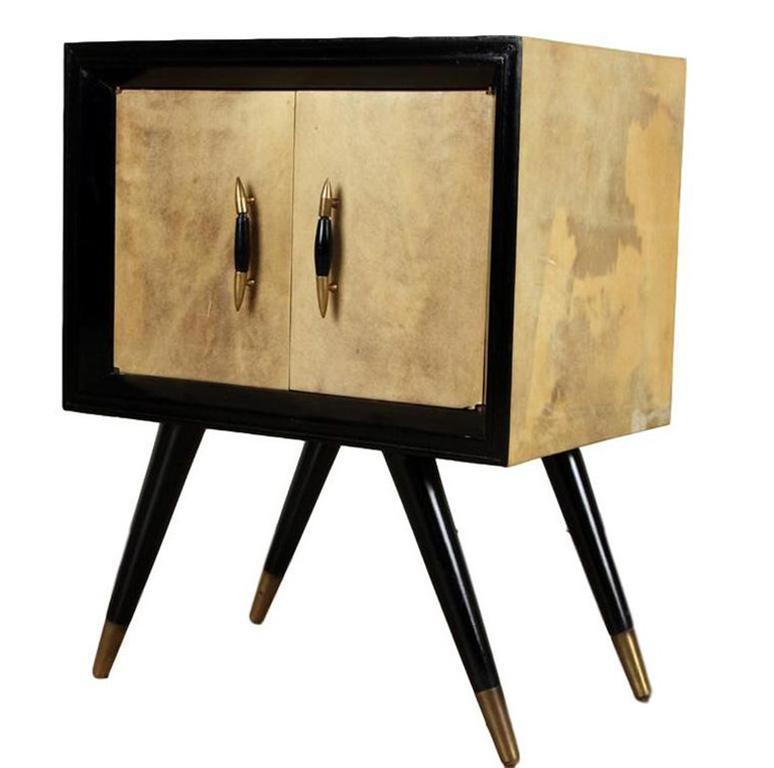 Pair Mid-Century Modern ebonized wood and parchment side cabinets with
bronze sabots, circa 1955. Measures: H 25, W 19.5, D 13
