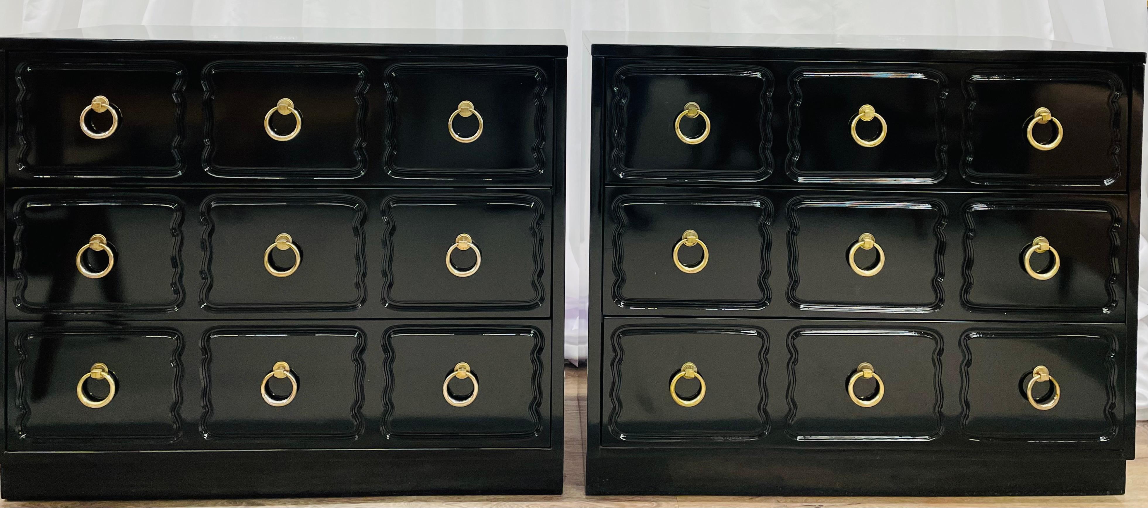 A Dorothy Draper Style Hollywood Regency Era pair of chests or bedside stands each having been recently re-lacquered in an ebony finish with brass circular pulls. The pair hand dovetailed in fine condition.
