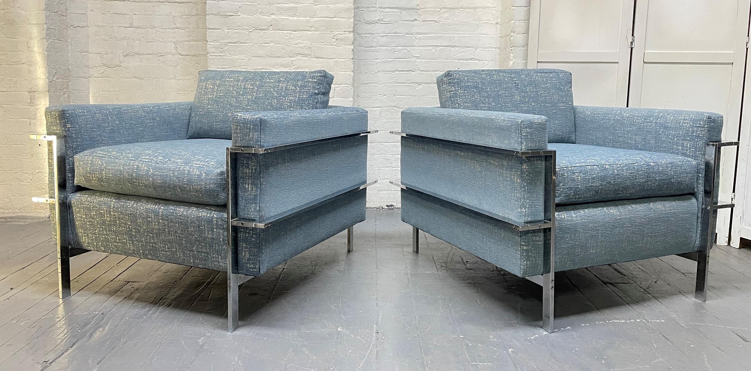 Pair of Mid Century Modern Flat Bar Chrome Upholstered Lounge Chairs.  The chairs have loose cushions, and the frames are steel and chrome.
Measures:  29H (to the top of back cushion) x 33D x 34W.  SH:  19