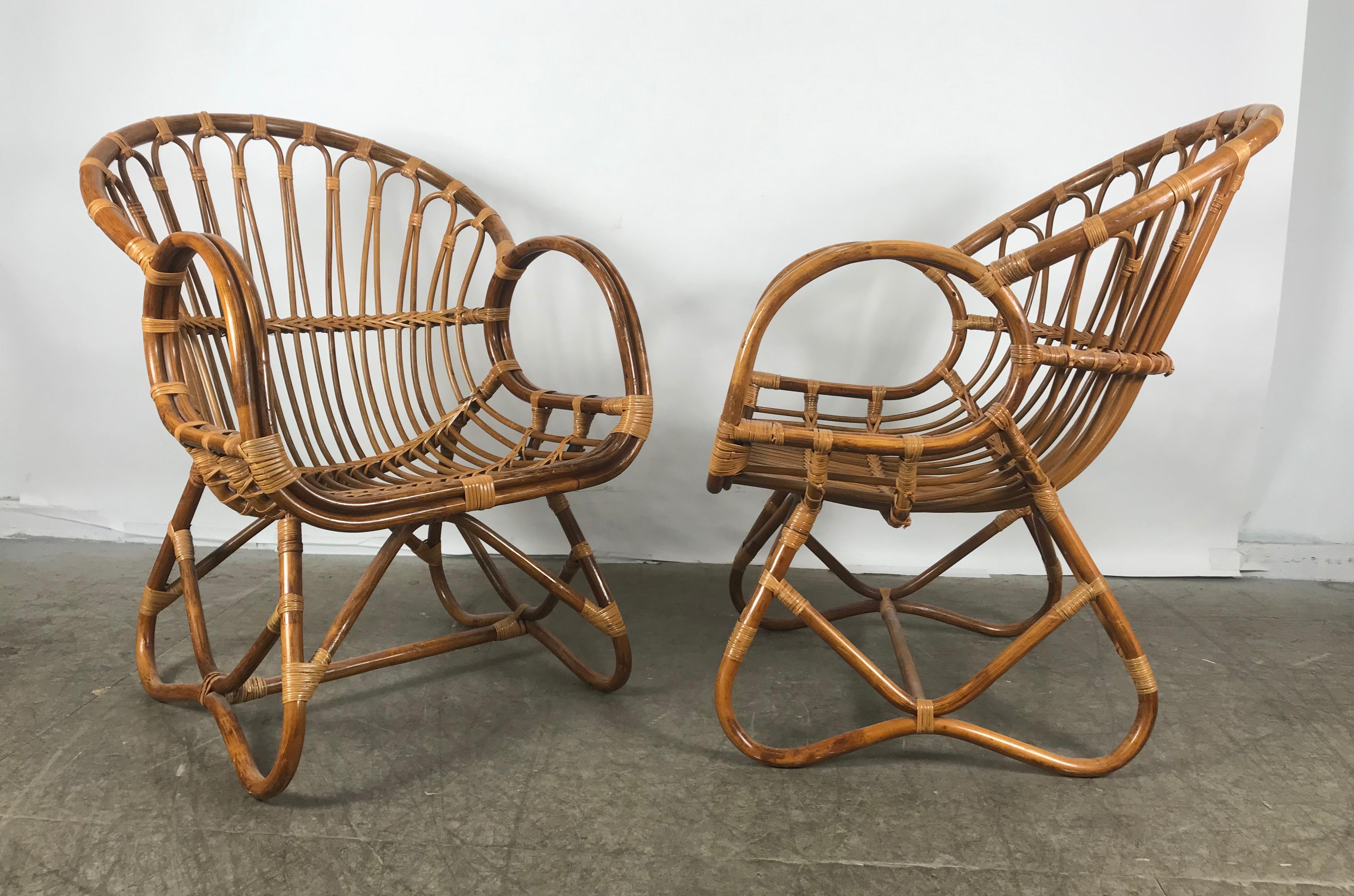 Pair of Mid-Century Modern style of Franco Albini bamboo or rattan lounge chairs. Classic Mid-Century Modern design.