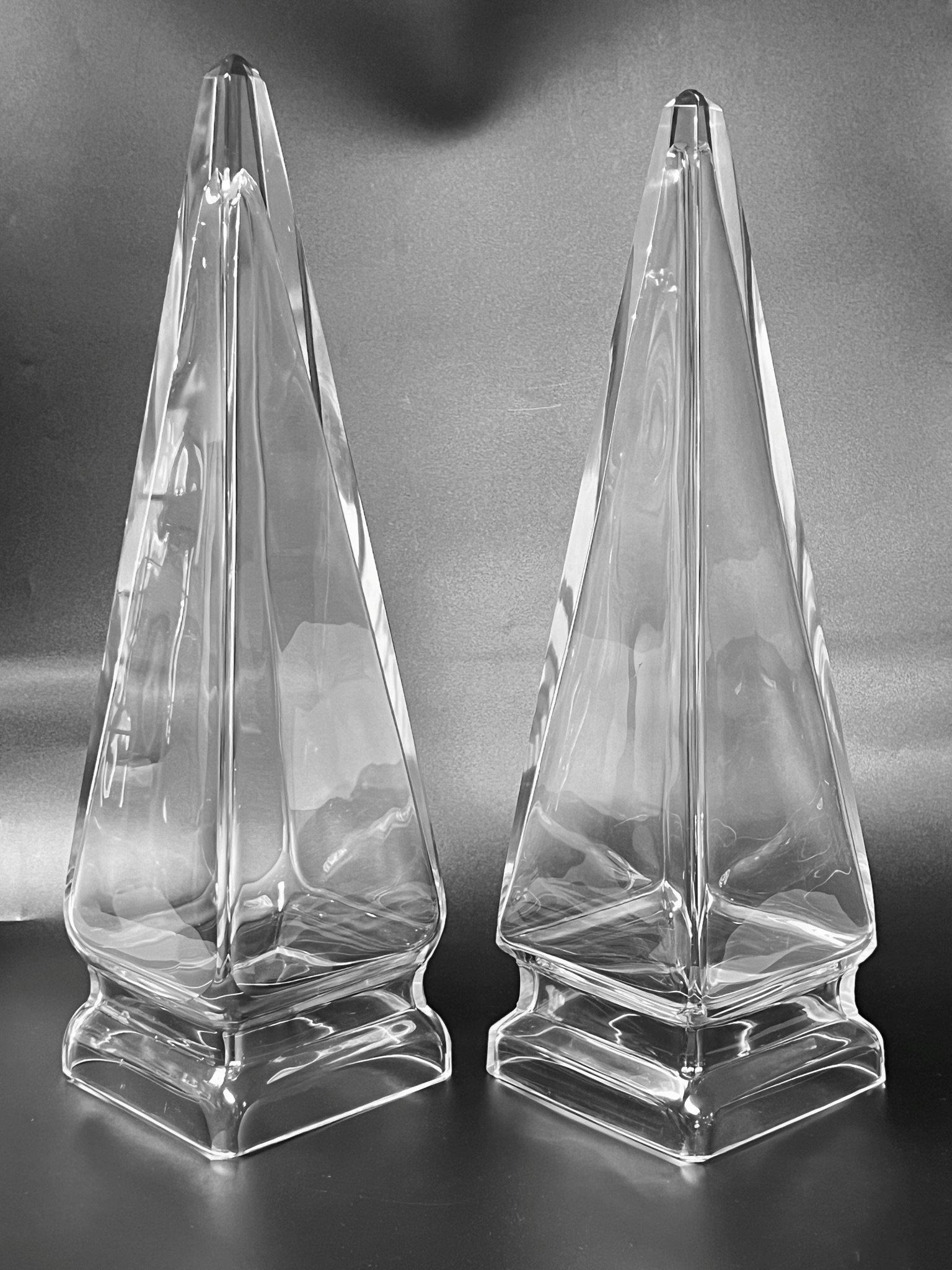 Pair of vintage, mid-century obelisks finely crafted from blown-molded clear glass with an elegant profile, with cut-shaped pinnacles and undersides.  Apparently unsigned.  Each in good condition, with light scratches, and with tiny chip losses at