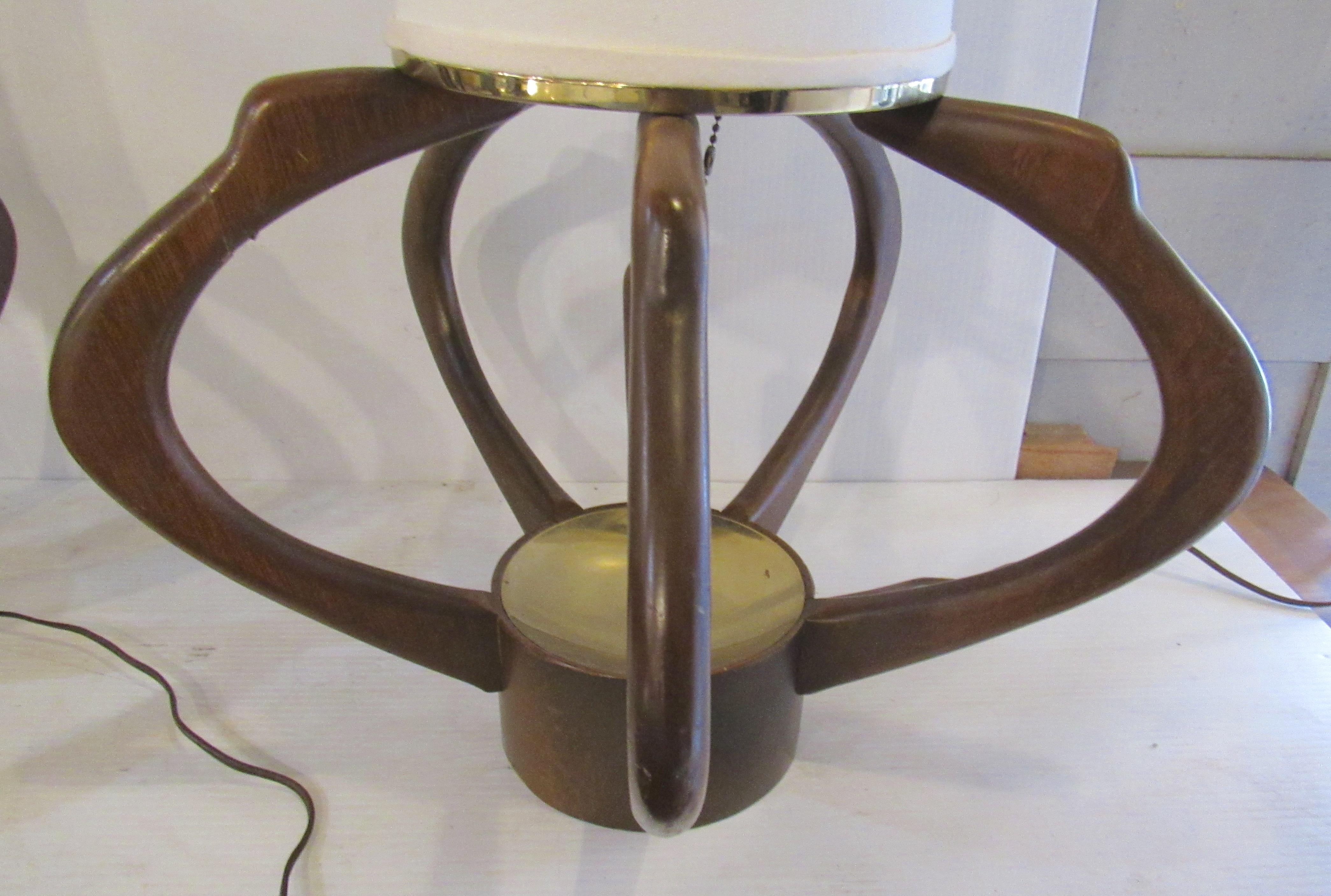 Pair of walnut base table lamps with medium base bulbs. Great sculpted design and soft light.
(Please confirm item location - NY or NJ - with dealer).   
 