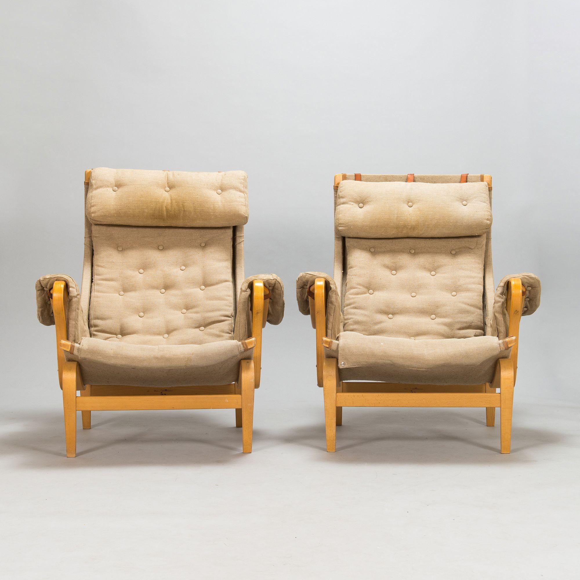 Pair Mid-Century Modern pernilla arm / lounge chairs by Bruno Mathsson, Denmark
 
Pair of Mid-Century Modern Lounge Chairs by Bruno Mathsson. Pair of 'Pernilla' easy chairs by Dux, late 20th Century. This pair of chairs maintains it's original