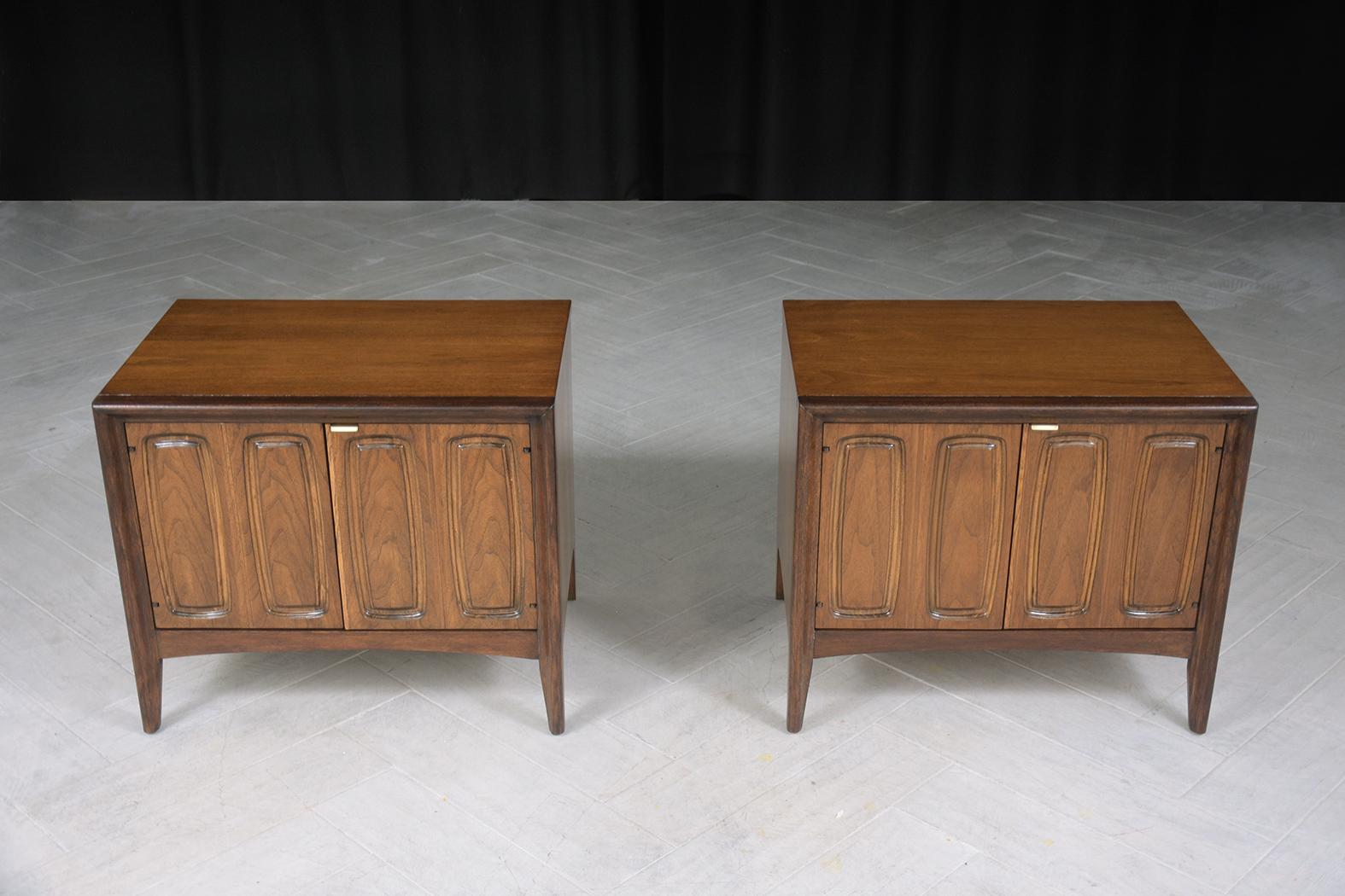 Introducing our meticulously restored Pair of Vintage 1960s Nightstands, skillfully hand-crafted from premium walnut wood. In exceptional condition, these mid-century modern nightstands capture attention with their harmonious blend of dark walnut