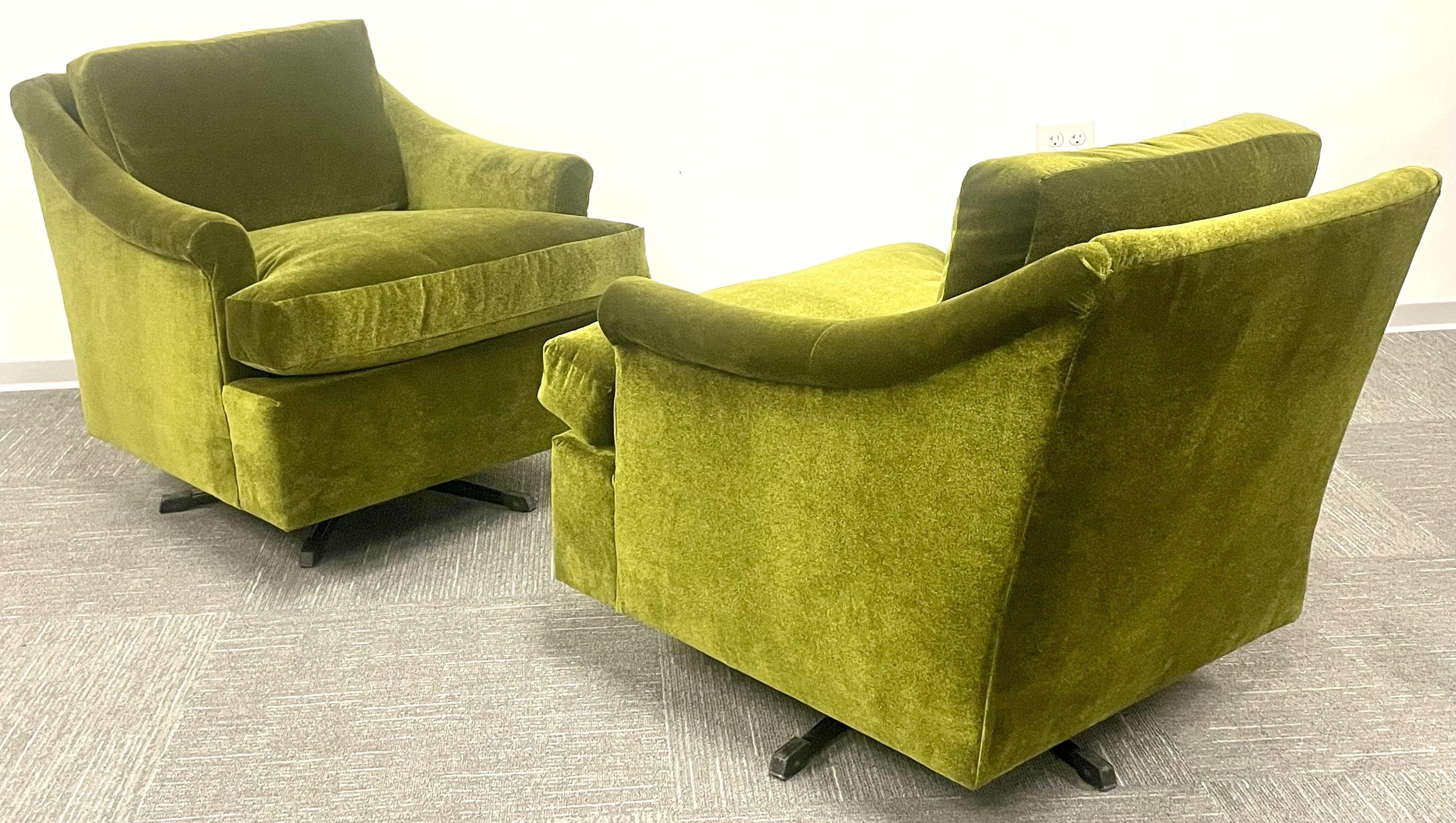 A pair of Milo Baughman style Mid-Century Modern swivel chairs. Each set on a spring swivel base leading to a finely upholstered frame of Olive Green color. This pair of sleek and stylish chairs are sturdy and comfortable.

Steel, olive green