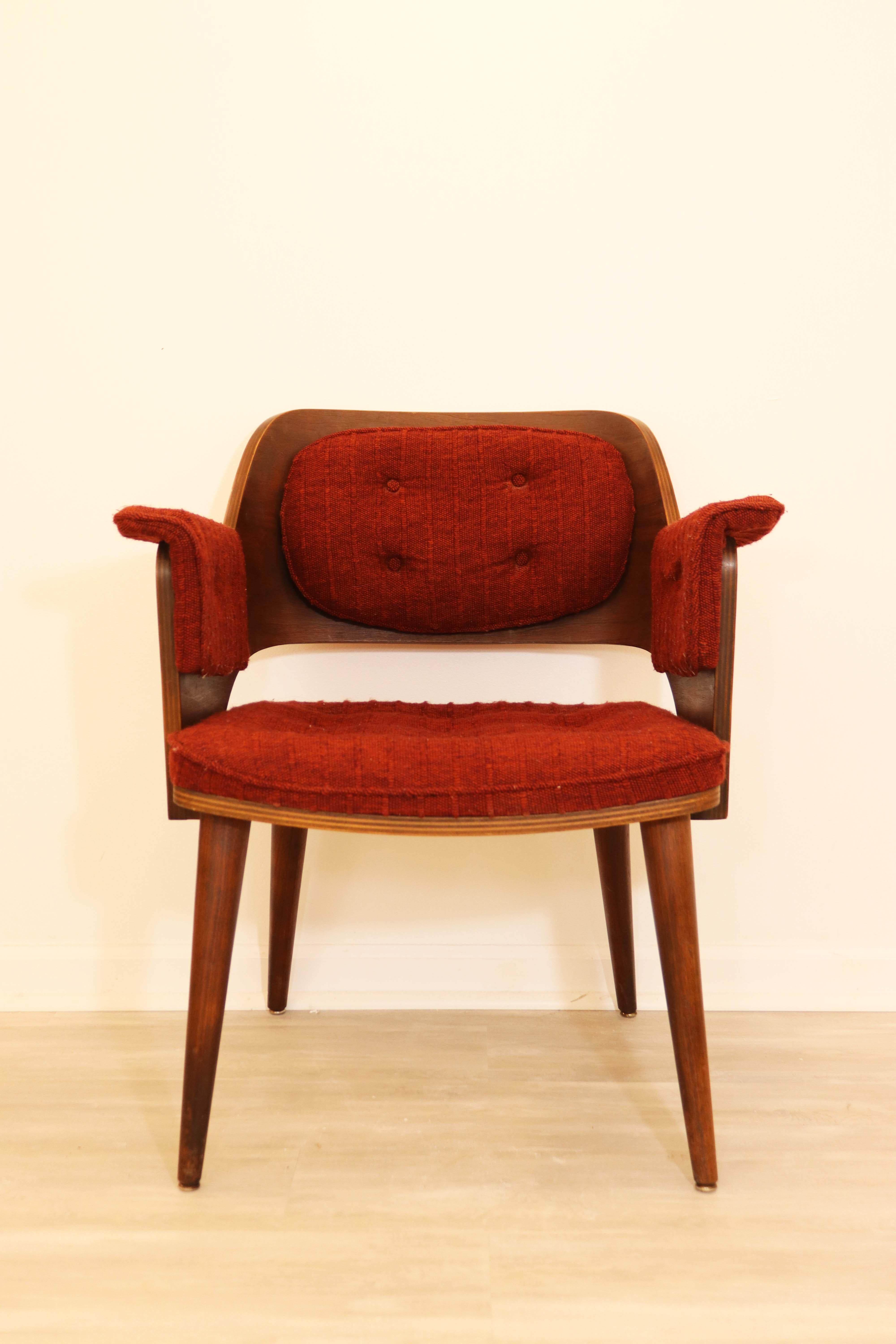 This pair of vintage bentwood armchairs are in original vintage condition with original burgundy tweed and button tufted upholstery. Structurally solid, this pair would work well with any Mid-Century Modern aesthetic.
 
