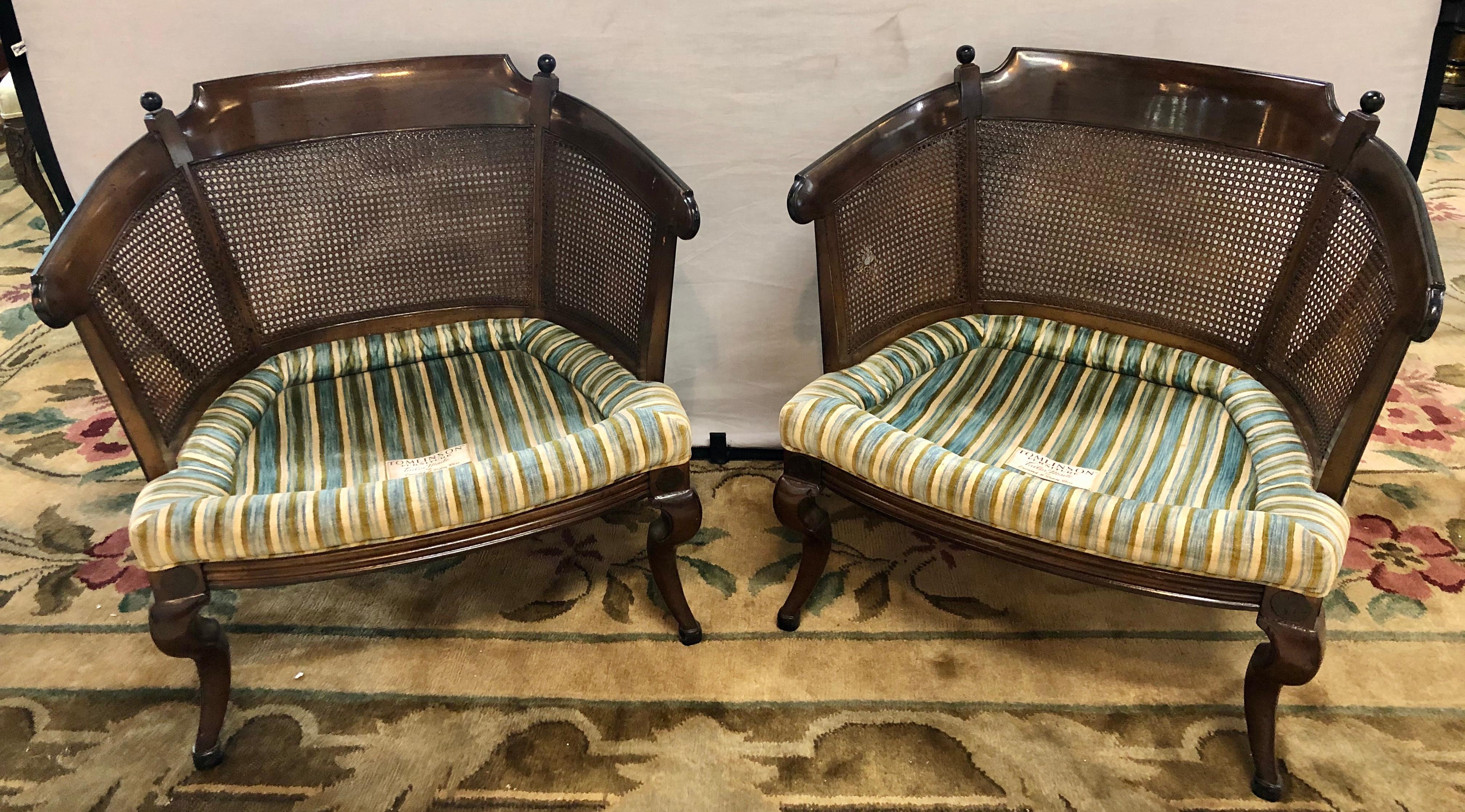 Pair of fine mahogany Tub chairs in striped upholstery with cushion. By Tomlinson Tailor Made for Leonard & Daisy Bisz. A simply stunning pair of arm chairs that are sleek and stylish. This fine set is certain to add sophistication to any room in