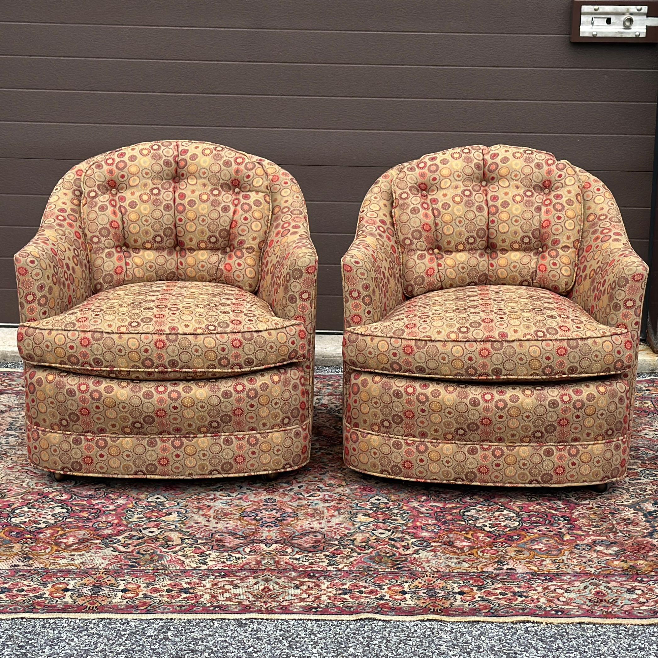 Vintage upholstered lounge chairs on rolling casters with loose seat and back cushions which are flippable. Previously reupholstered and still in very good shape and clean with minor wear around edges as pictured.