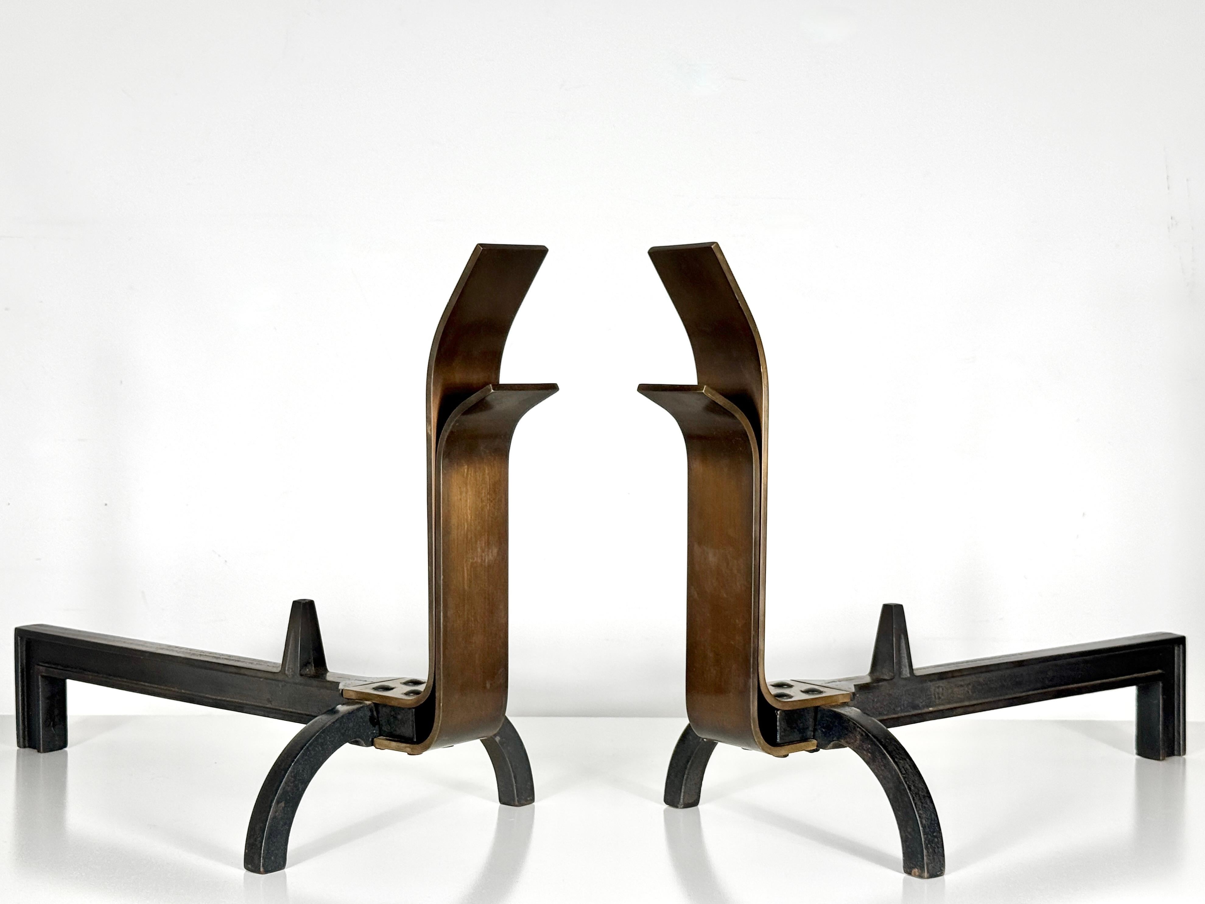 A rare pair of andirons designed by The Saarinen Swanson Group circa 1947

Minimalist design with curved bronze uprights on cast iron arched legs

10 inch width
22 inch depth
16 inch height

Designed by J Robert Swanson, in collaboration with Pipsan