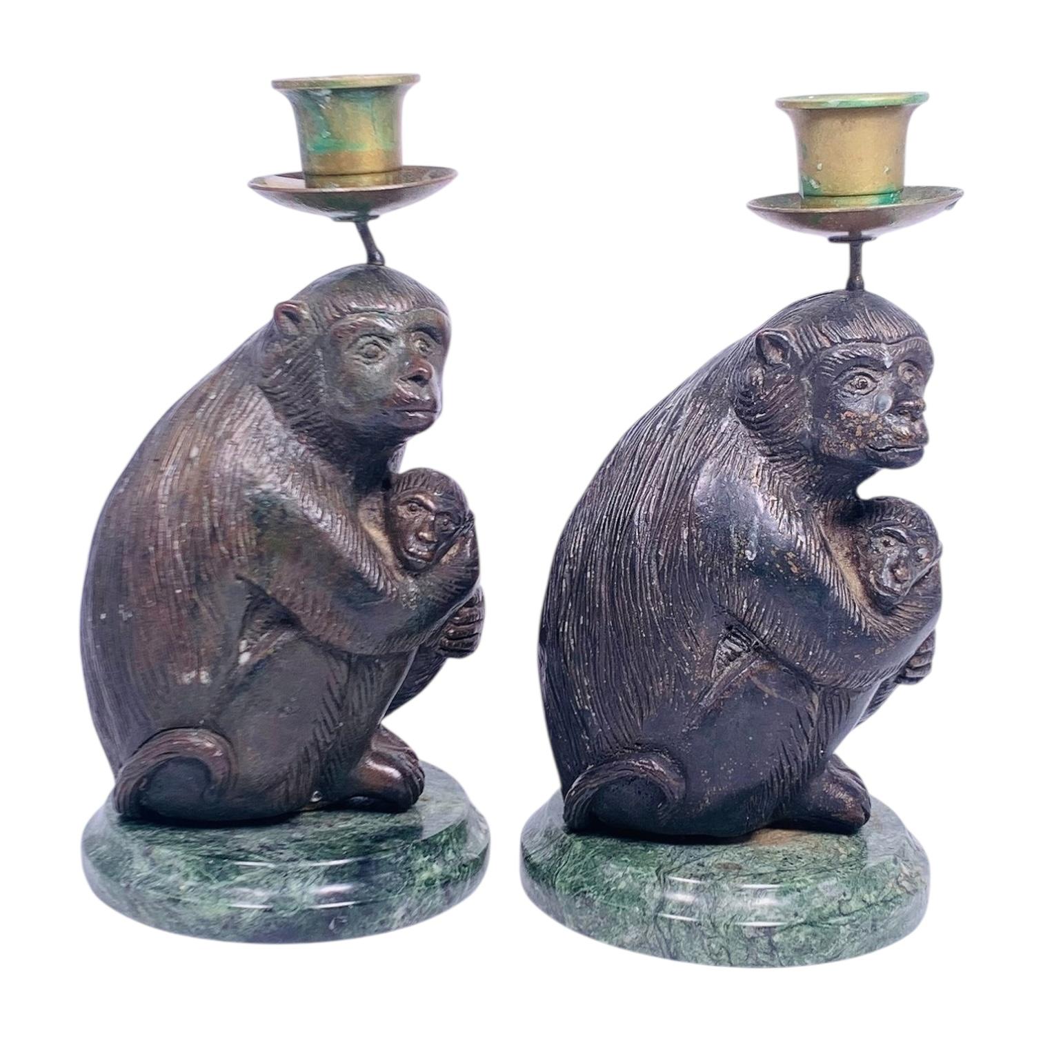 Pair of mid century  patinated bronze and marble candlesticks (candle holders) depicting seated monkeys, each 7 3/4 inches tall.