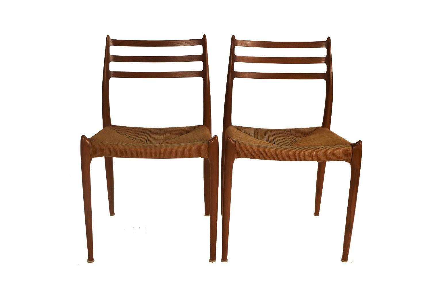 An absolutely stunning pair of Mid-Century Danish Modern  chairs model 78 designed in 1962 by Niels Otto Moller for J.L. Møllers Møbelfabrik in Denmark. These gorgeous chairs feature beautifully sculpted teak frames and exquisite original woven
