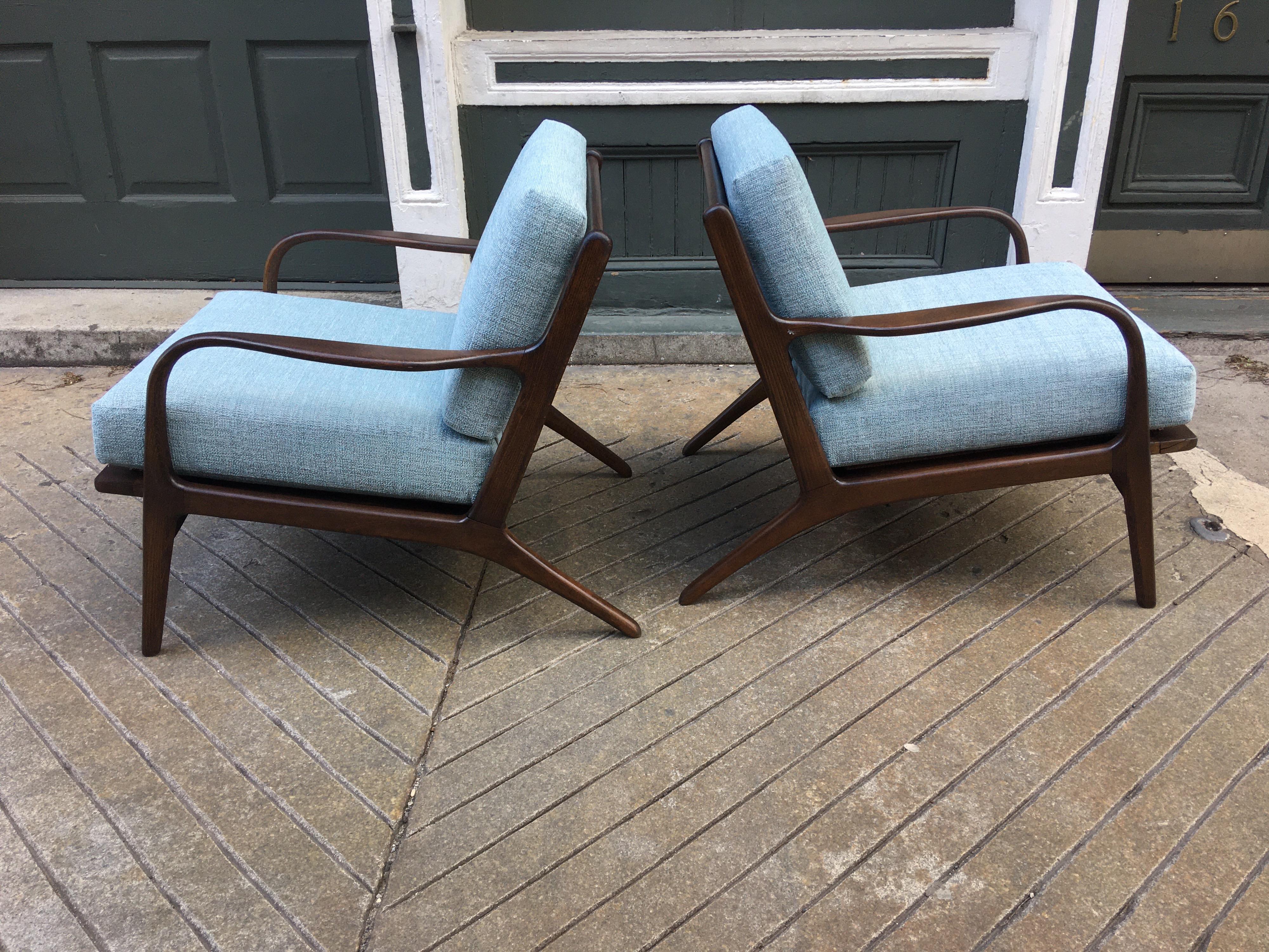 Pair of midcentury open armchairs. Newly refinished and reupholstered! Chairs were produced in Yugoslavia probably in the late 1960s or early 1970s. Chairs break down, originally done this way to save importing costs! But now perfect to get into