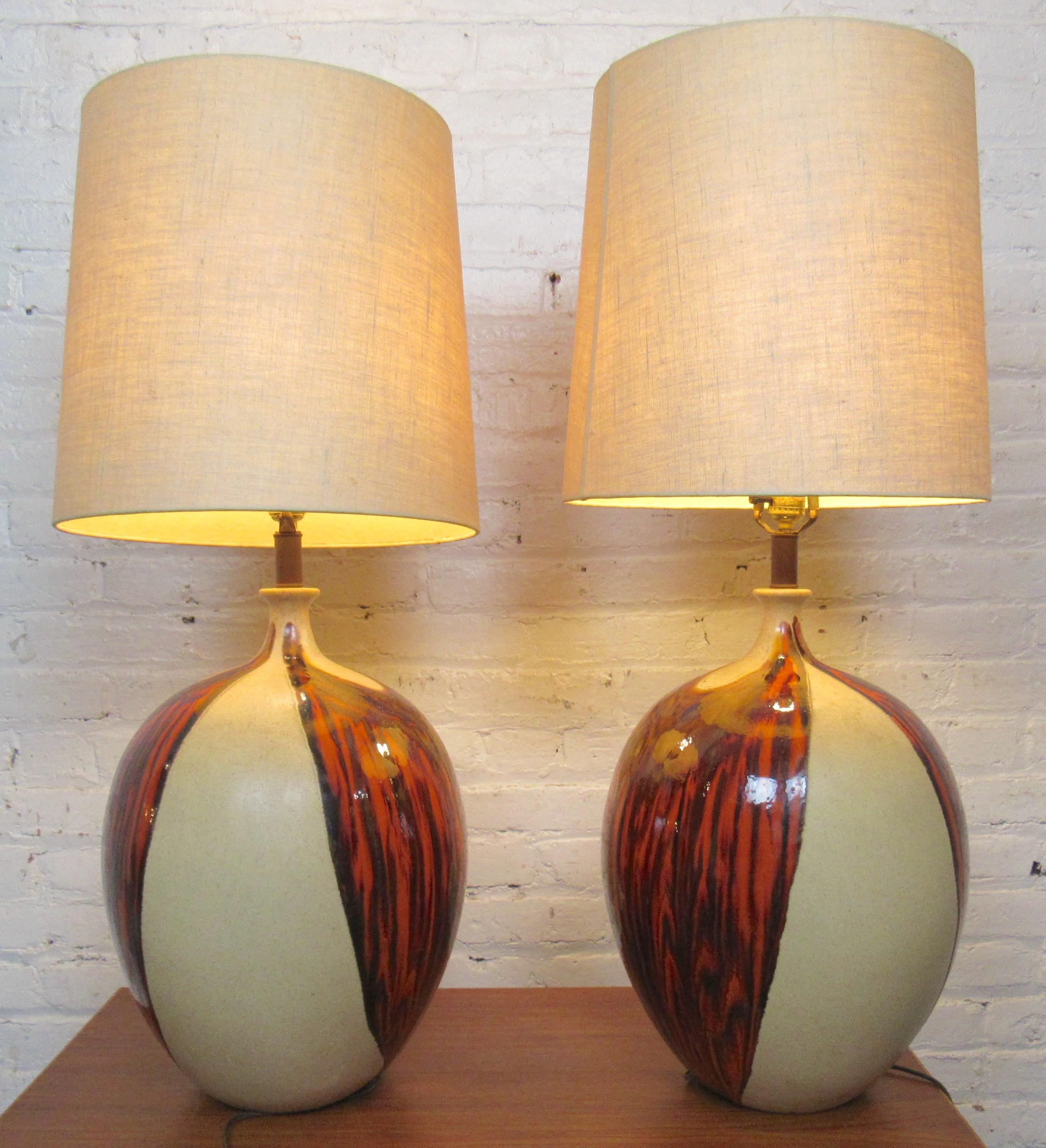 Pair of mid-century ceramic lamps with shades. Bright red coloring over beige, with single medium base socket.
Location: Brooklyn NY.