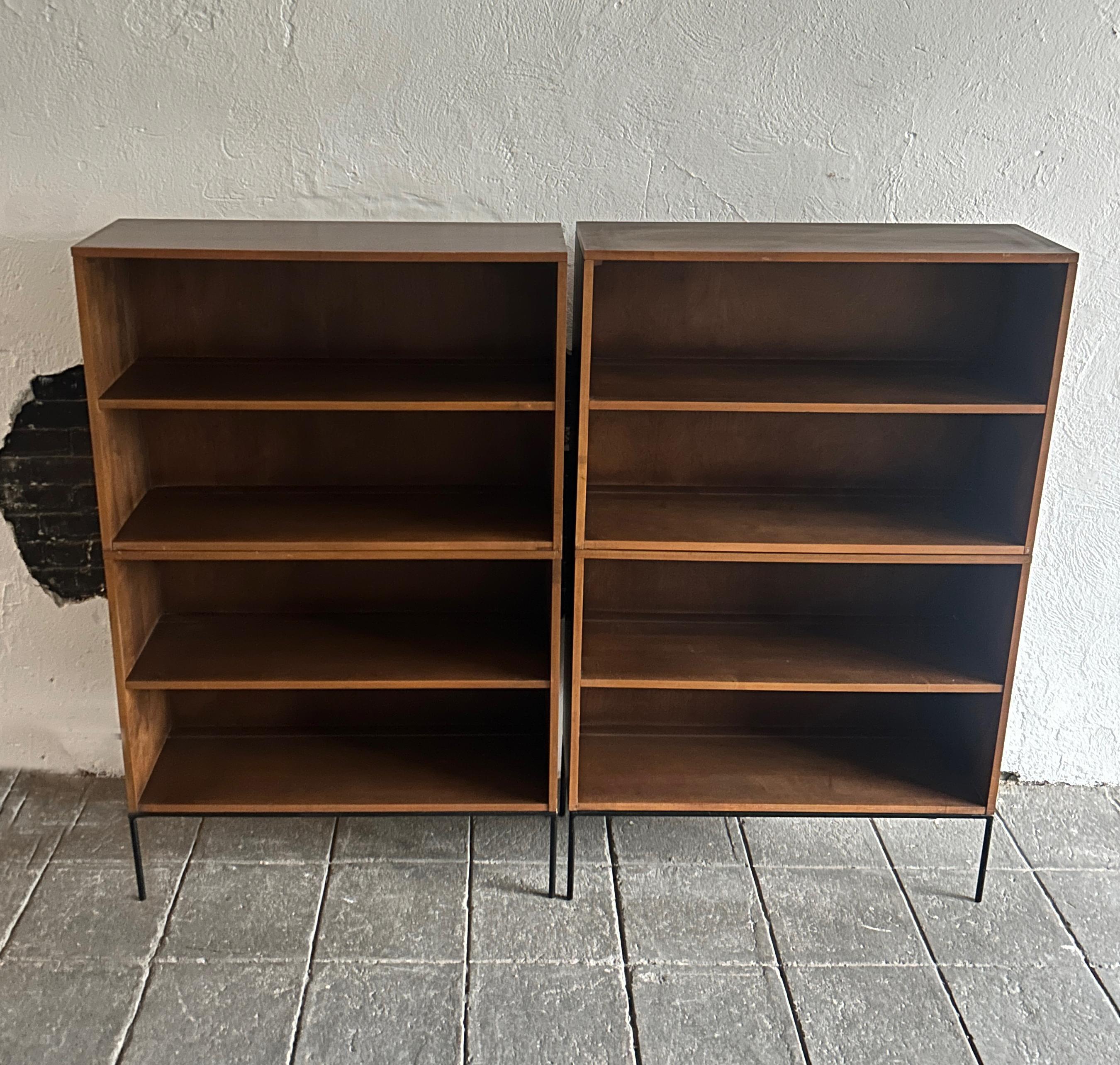 Pair of vintage midcentury Paul McCobb Double high bookcases bookshelves #1516 original walnut finish over solid maple with solid Iron 4 leg Iron base. Beautiful bookcase set by Paul McCobb, circa 1950s Planner Group, single center fixed shelf,