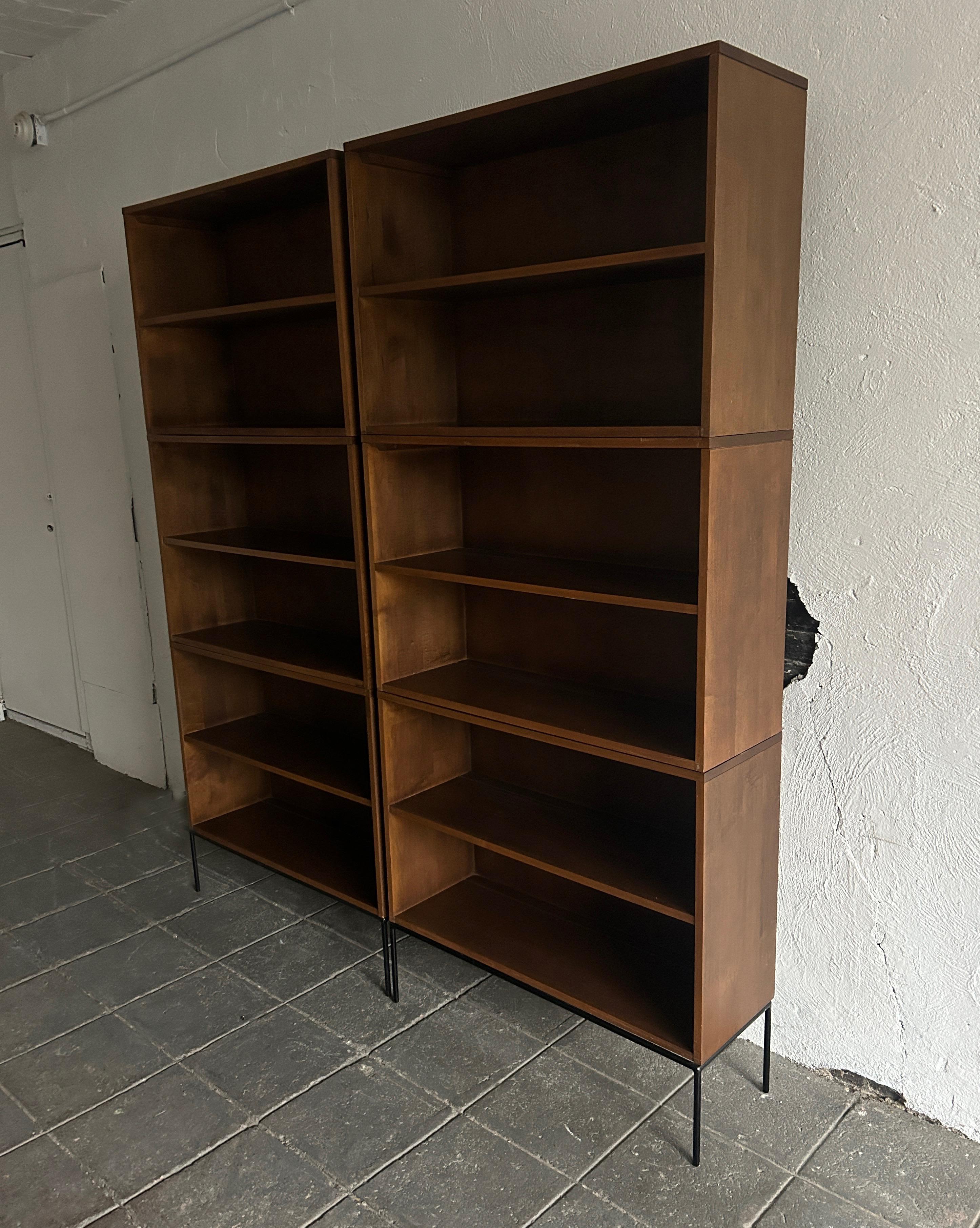 Pair of vintage midcentury Paul McCobb triple high bookcases bookshelves #1516 original walnut finish over solid maple with solid Iron 4 leg base. Beautiful bookcase set by Paul McCobb, circa 1950s Planner Group, single center fixed shelf, solid