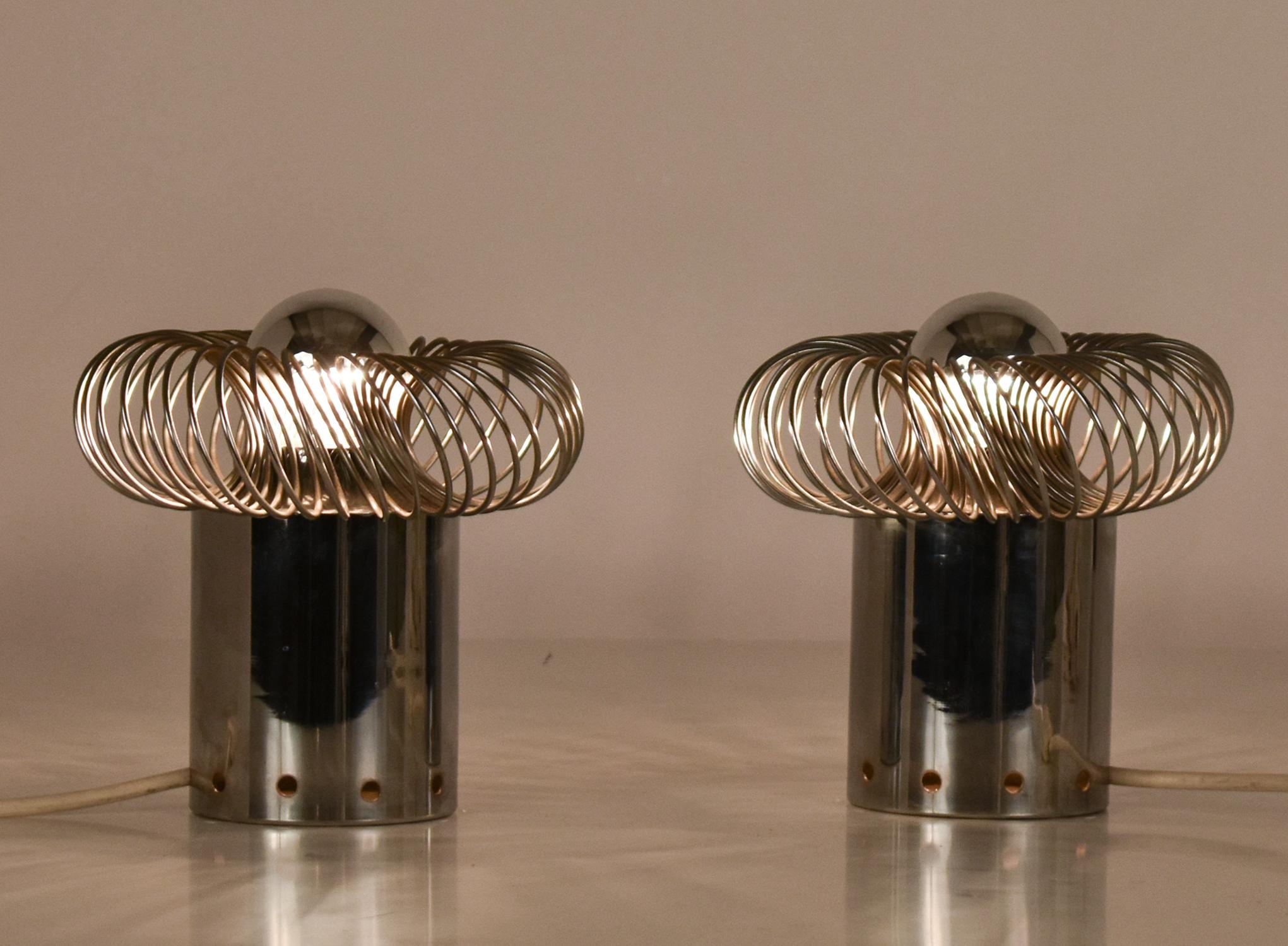 
 Pair Mid-Century Philippe Rogier Oxar Table Lamp, 1970's. Chrome Metal
Materials: Stainless steel tubular base. Stainless steel parts. Round chrome spring lampshade. 



Electricity: 1 bulb E27, 1 x 100 watt maximum, 110/220 volt.
Any type of