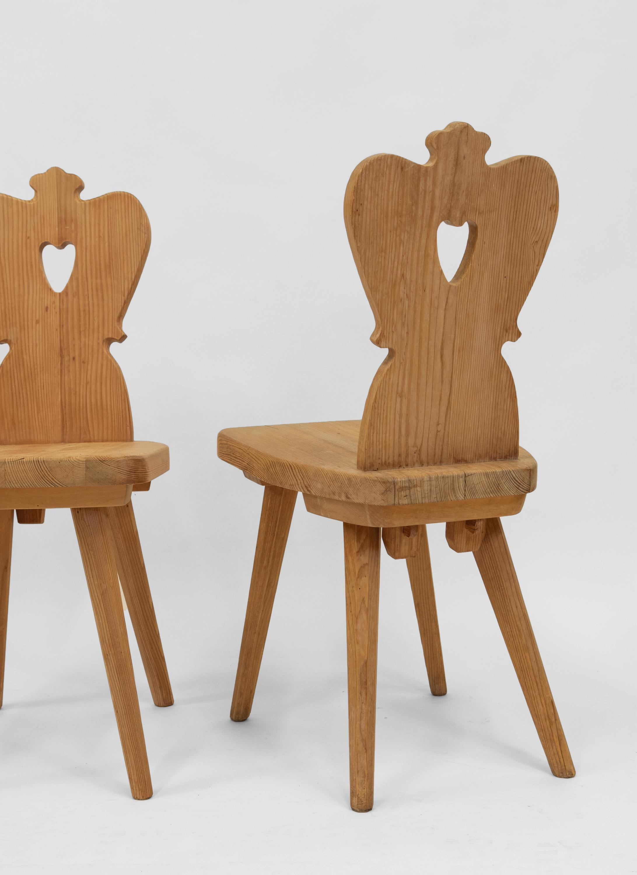 Pair mid-century pine Alpine chairs. Central European - Circa 1950s. 

Delivery is INCLUDED in the price for all areas in MAINLAND England & Wales. 

The pine has a lovely slight bleached appearance with age, one being slightly lighter than the