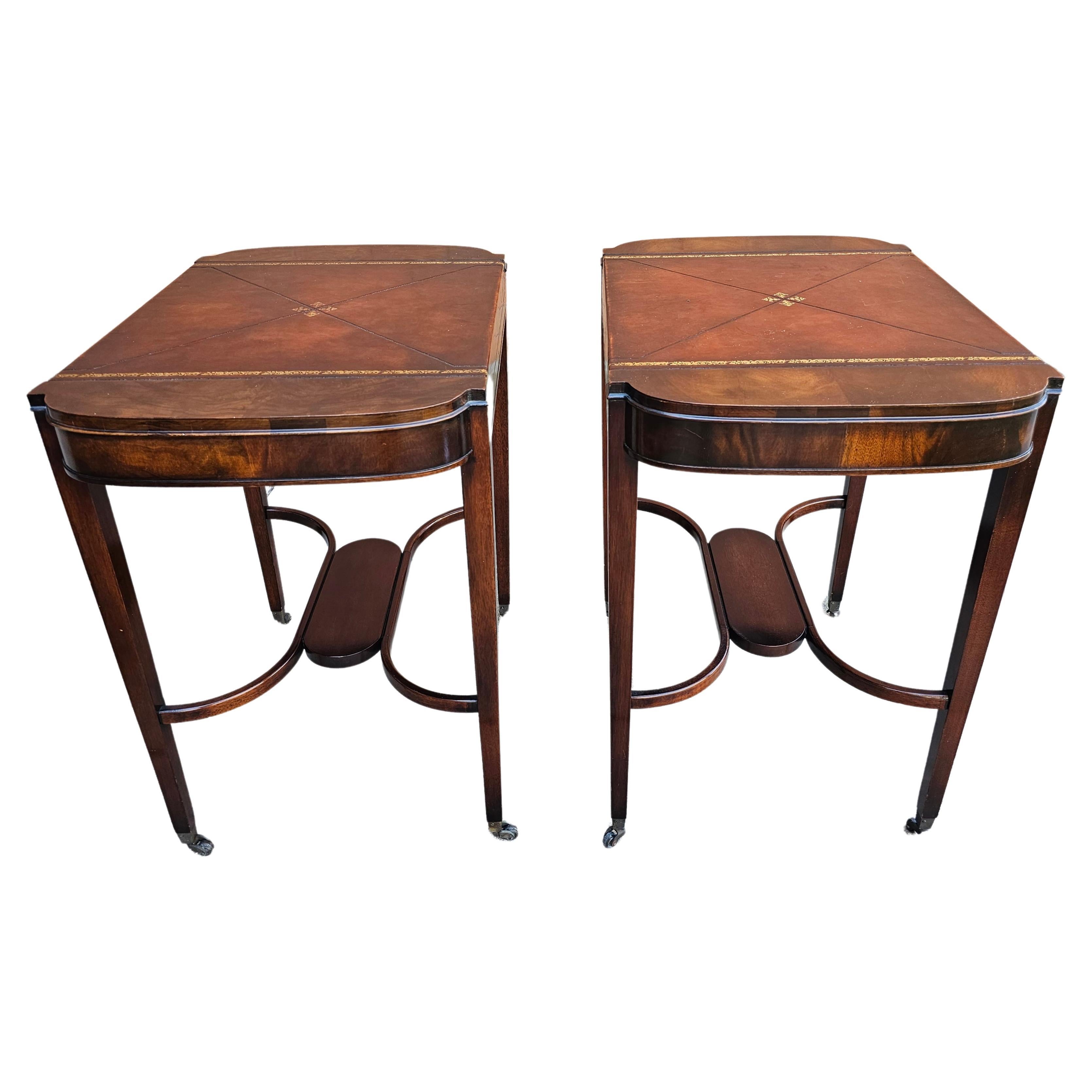 Pair Mid Century Regency Weiman Tooled Leather Top Mahogany Side Tables on wheels in great vintage condition. 17.5