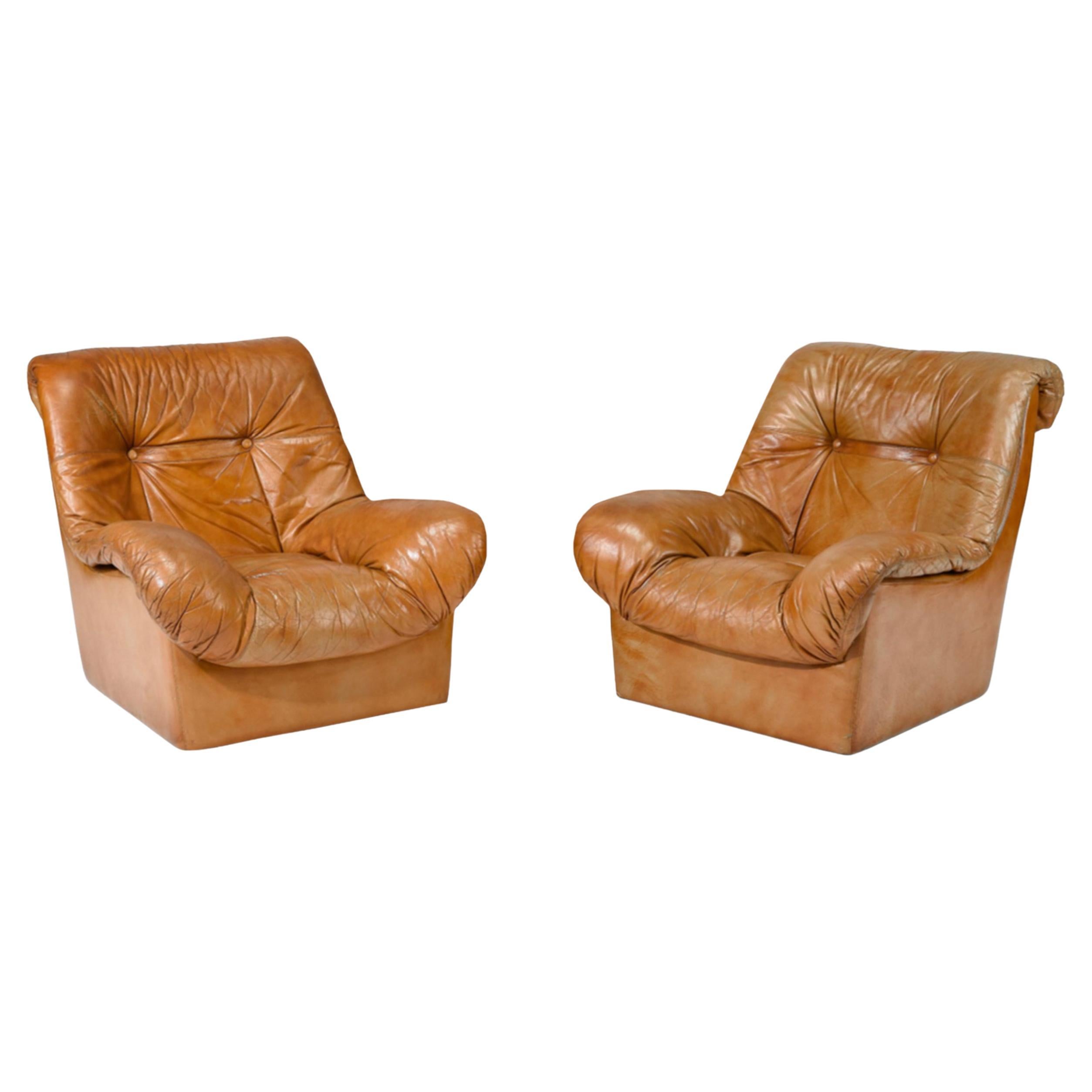 Pair Mid Century Scandinavian Danish modern Tan Leather Puffy Lounge Chairs For Sale