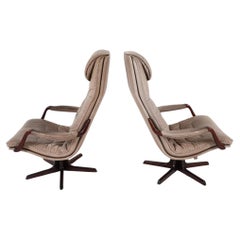 Pair Mid Century Scandinavian modern Tan High back Leather Swivel Lounge chairs