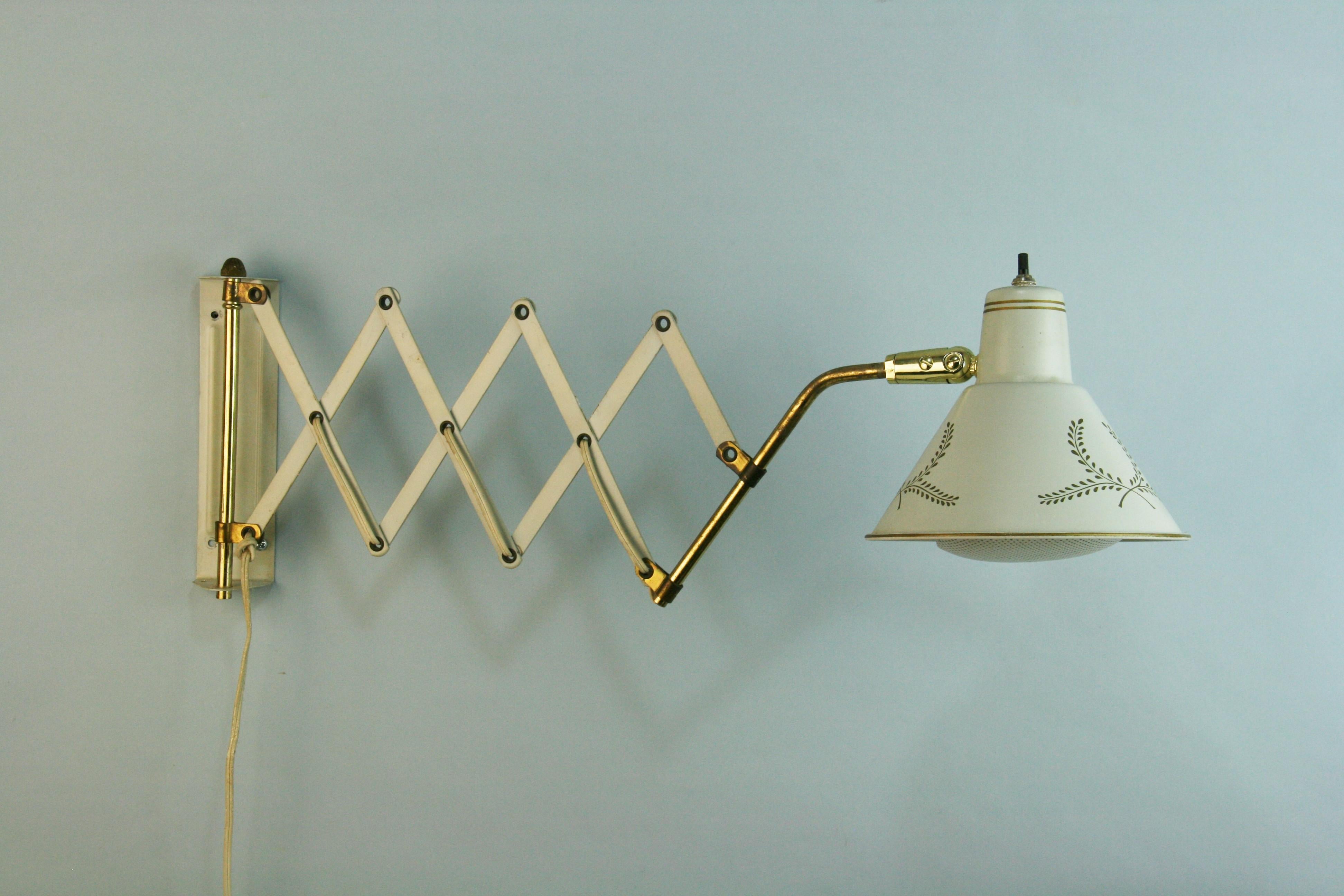 3-942  Mid Century scissor wall lamps
Metal is light French gray color
Has clip on light diffuser
On of switch on bulb holder
Takes one 60 watt Edison bulb
Original wiring in good working condition.