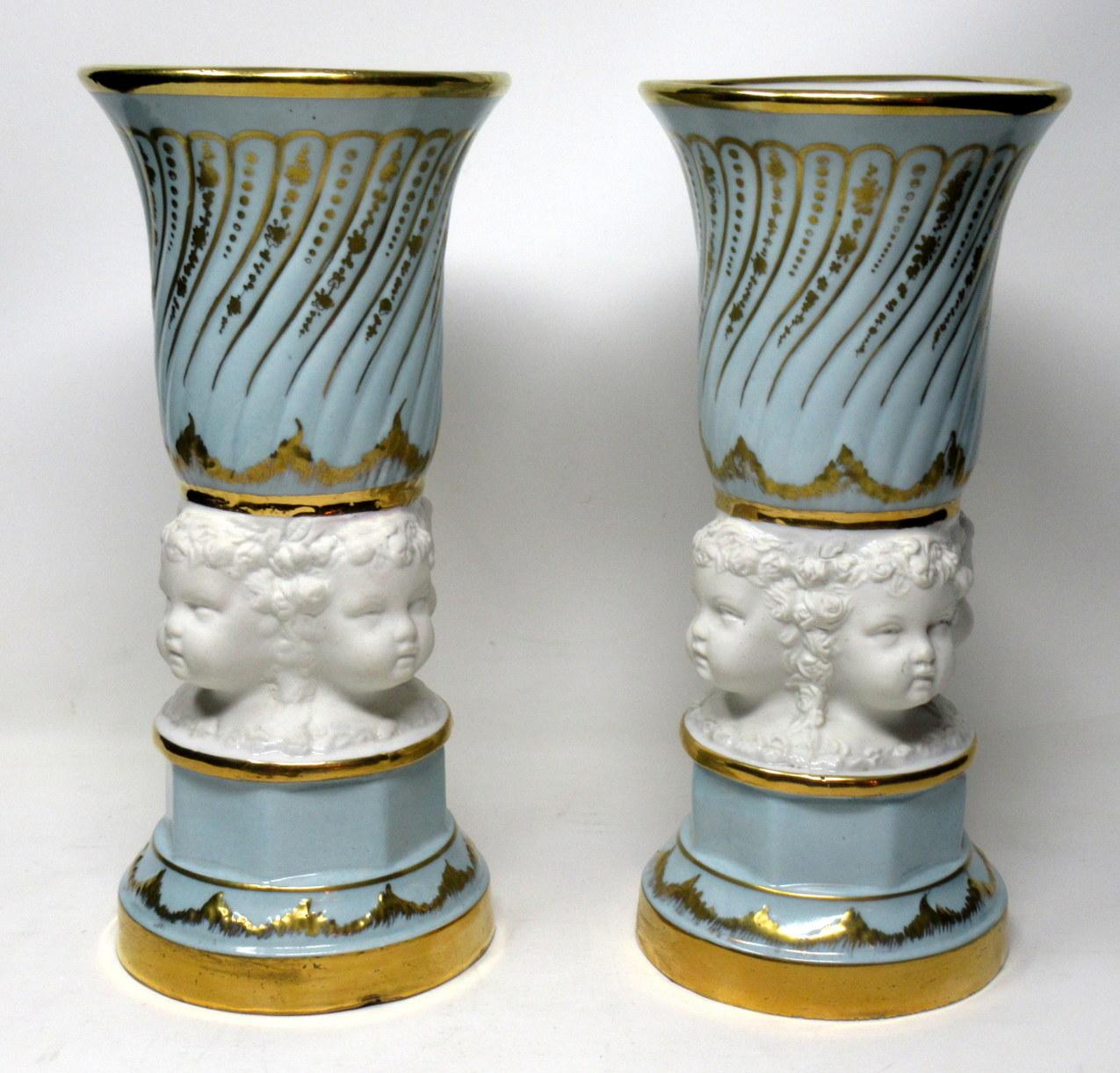 Stunning pair of French Sèvres style soft paste porcelain and Parian vases or urns of traditional cylindrical form and French origin, circa mid-20th century.

The unusual central areas with a continuous detail depicting Cherub faces in Parian