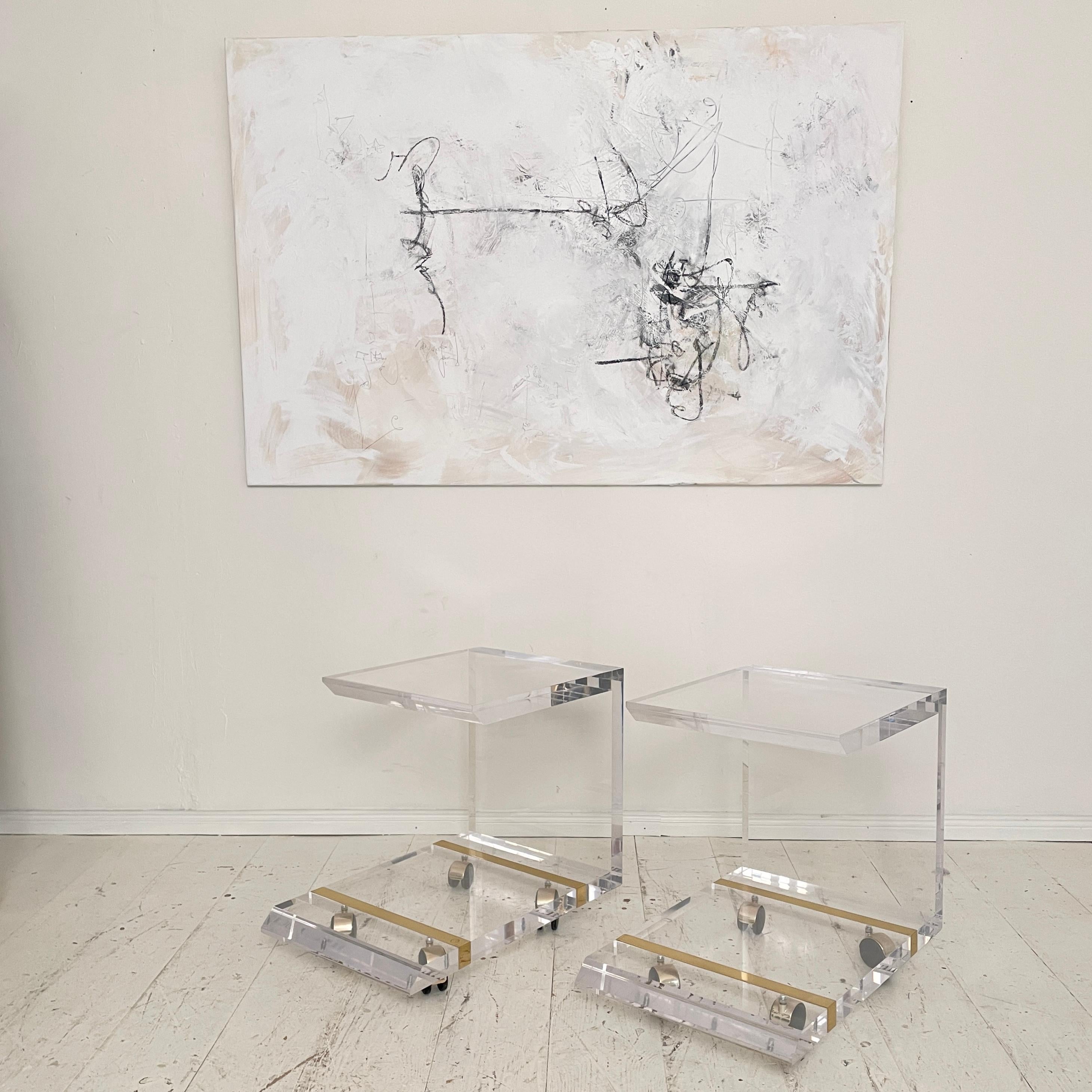 This Pair midcentury Side Tables by Charles Hollis Jones made around 1970. They are made out of Acrylic and Brass. The Tables are on wheels.
Great original condition and Patina.
A unique piece which is a great eye-catcher for your antique, modern,