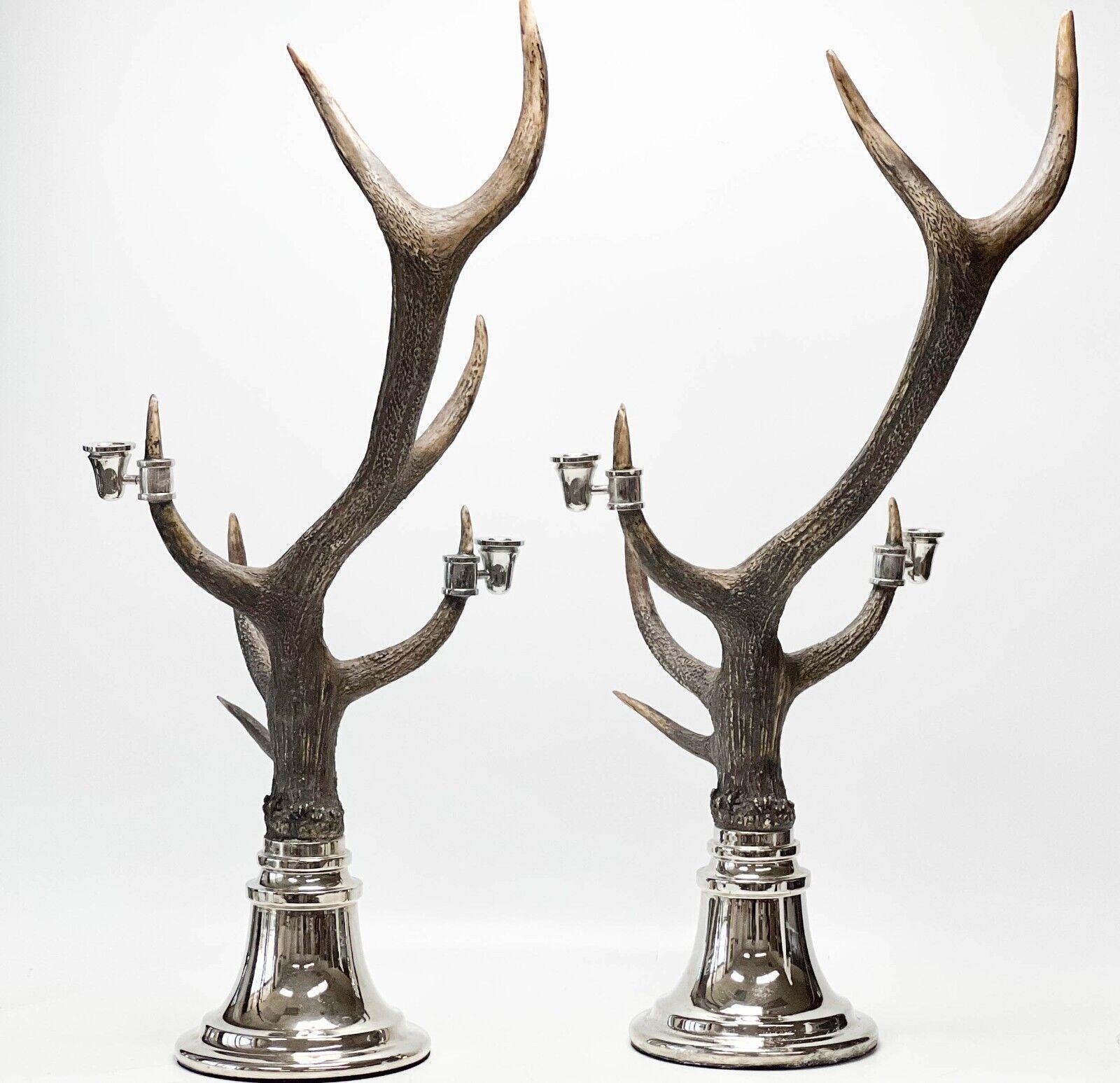 Pair mid century simulated horn candelabras. Each with two attached candle holders. Circular silver plate bases with felt to the underside.

Additional Information: 
Type: Candelabras
Weight Approx., 12 lbs
Measures Approx., 12 inches x 12 inches x