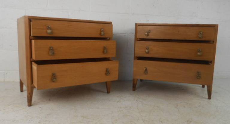 Pair of three-drawer midcentury nightstands with brass pulls from the Casaluda mollection by Mount Airy Furniture. Stylish vintage bedroom storage, please confirm item location (NY or NJ) with dealer.