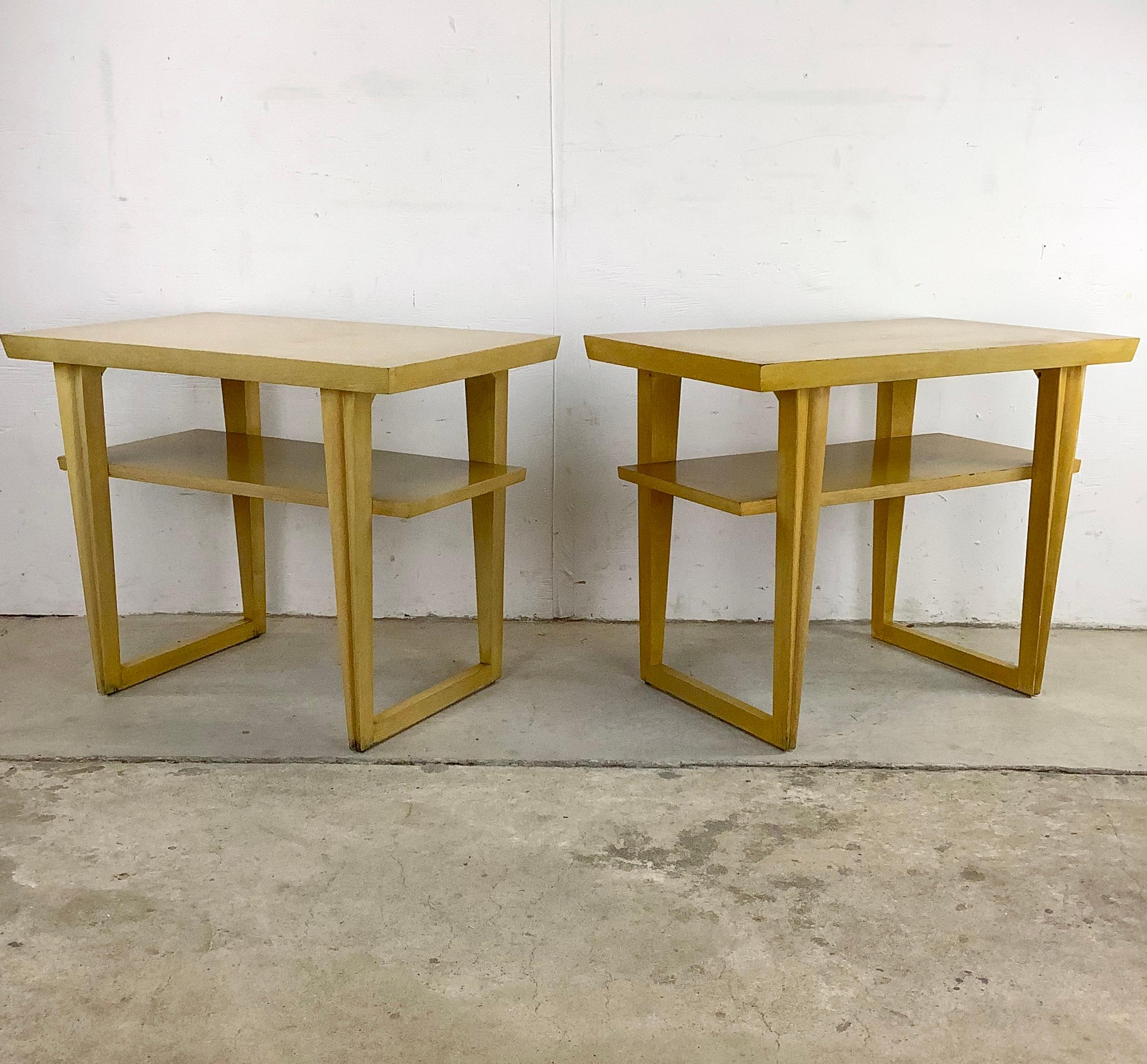 This striking pair of Vintage Modern Side Tables make a stylish and versatile set of end tables that elevate your living space with their timeless appeal. Crafted during the mid-century era, these side tables showcase the iconic design elements that