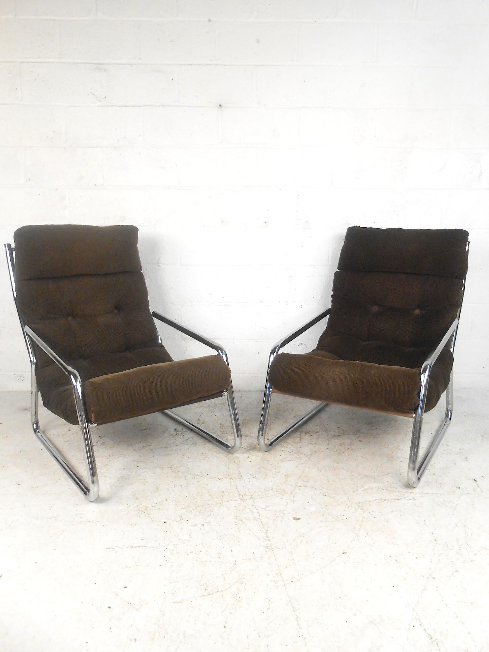 This set of midcentury chairs features plush ribbed upholstery creating an effortlessly comfortable seating option. With classic style and chrome accents, these pieces will fit in almost any modern space. Clean classic and comfortable. Please