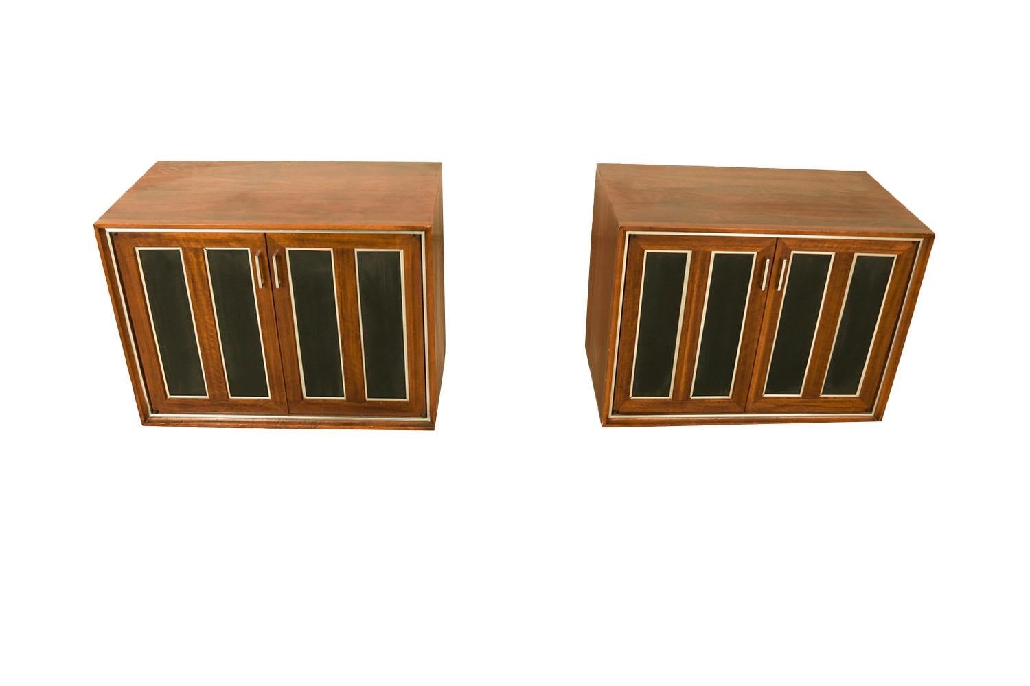 Extraordinary pair of Mid-Century Modern double door cabinets /nightstands by Lane Furniture. This retro pair was constructed with top-of-the-line hardware, and excellently crafted woodwork. Each features a walnut wood frame with a rectangular top,