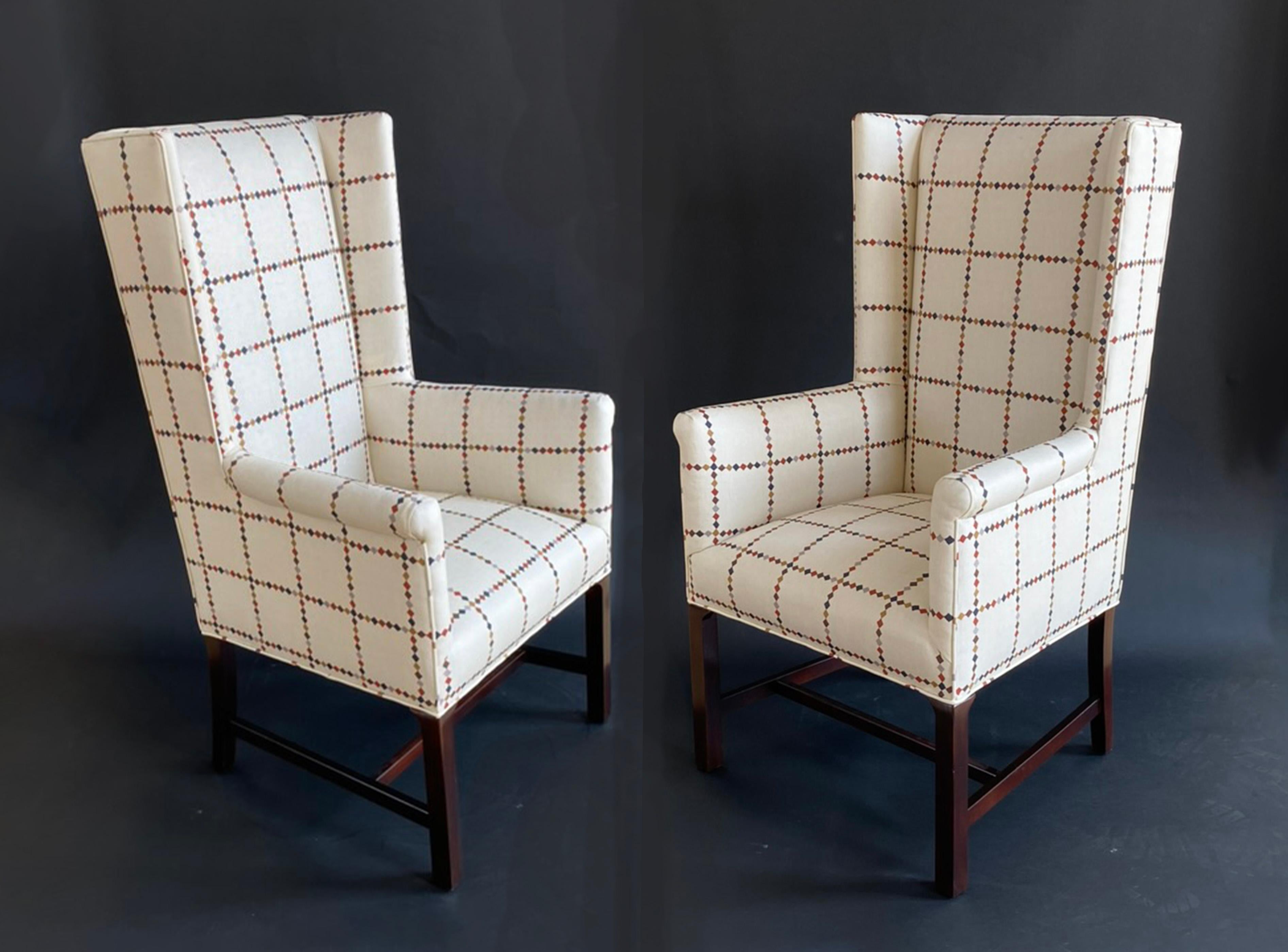 Here is a pair of slim-profile wingback chairs from the mid-century that have been refinished and meticulously reuholstered in a heavy-weight French linen printed fabric by Matt Murphy Studio. The chairs have a tall, modern profile--measuring 45.5