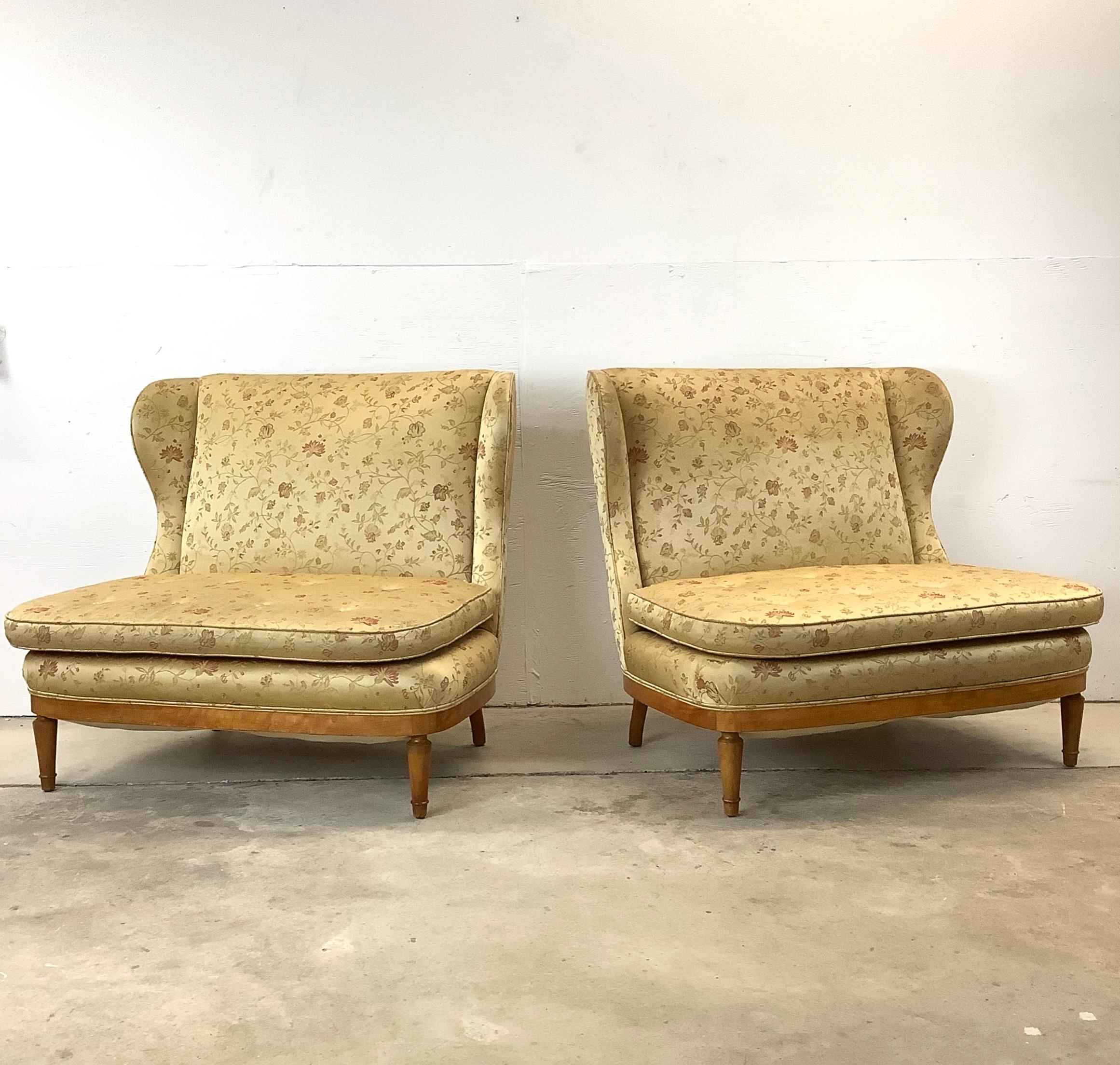 Discover the allure of mid-century elegance with this pair of 20th-century vintage wingback loveseats, reminiscent of the exquisite designs by Paolo Buffa. These loveseats are a beautiful synthesis of classic Italian flair and timeless comfort,