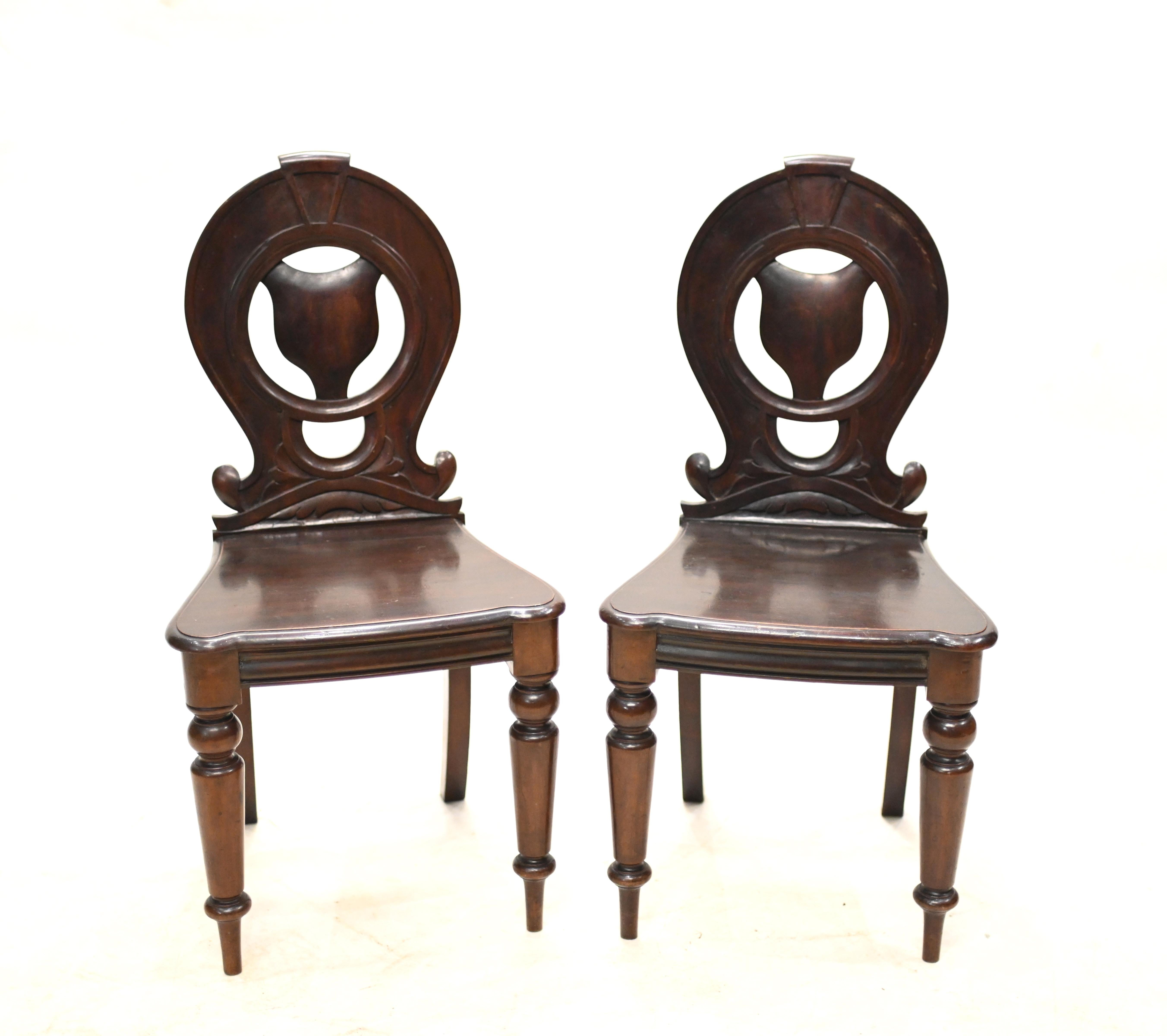 Elegant pair of Victorian hall chairs in mahogany
Circa 1840 on this refined pair of chairs
Great design and would work well as accent chairs
Bought from a private residence in London's Bloomsbury
Offered in great shape and will ship to anywhere in